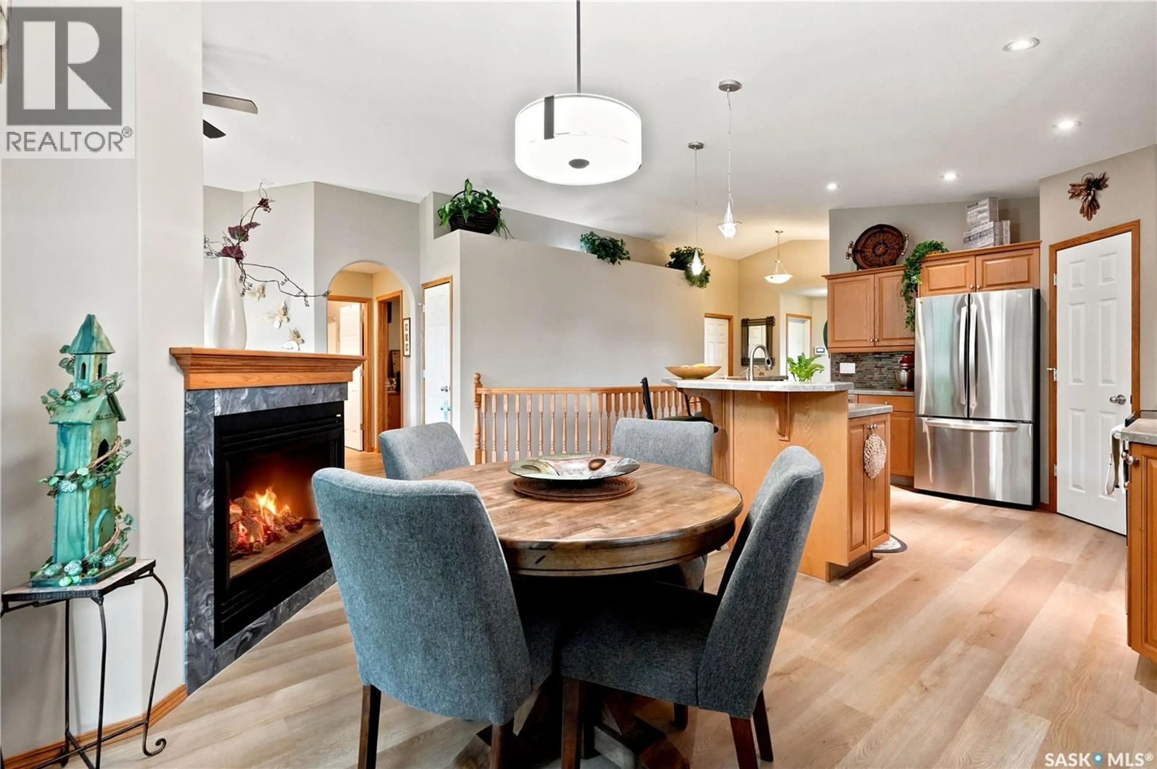 Open concept kitchen, wood/laminate floor for 3039 CRANBOURN CRESCENT, Regina Saskatchewan S4V3B3