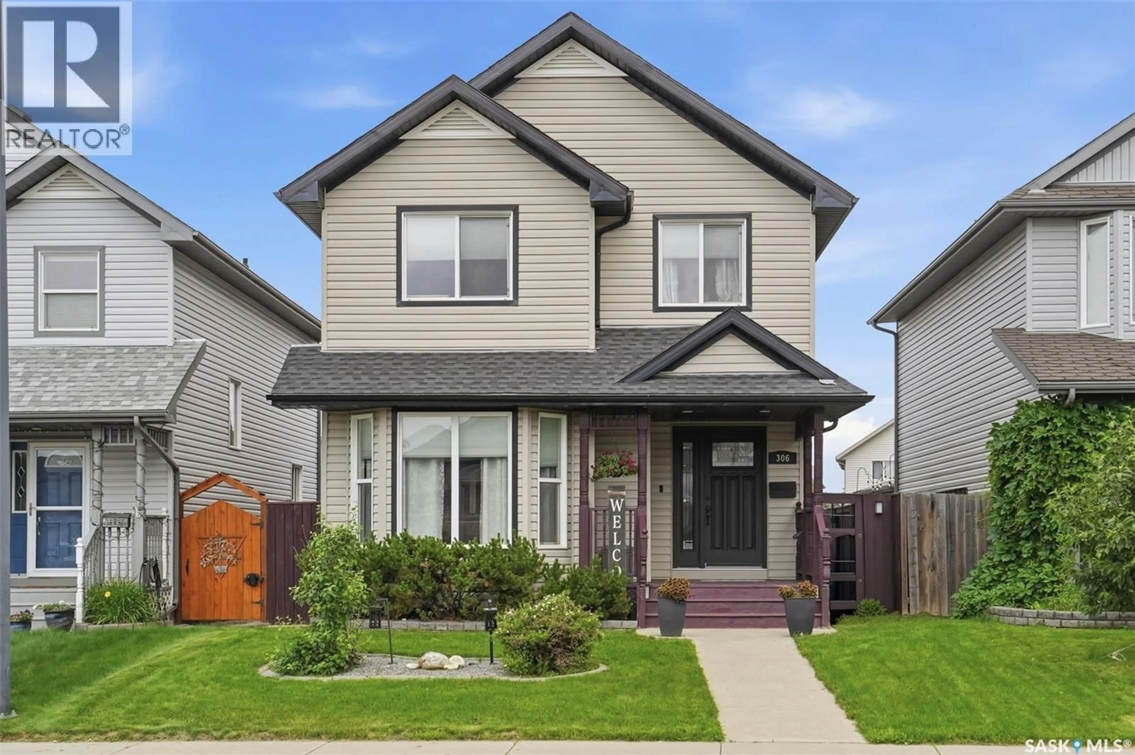 Home with vinyl exterior material, street for 306 DENHAM COURT, Saskatoon Saskatchewan S7K1E5