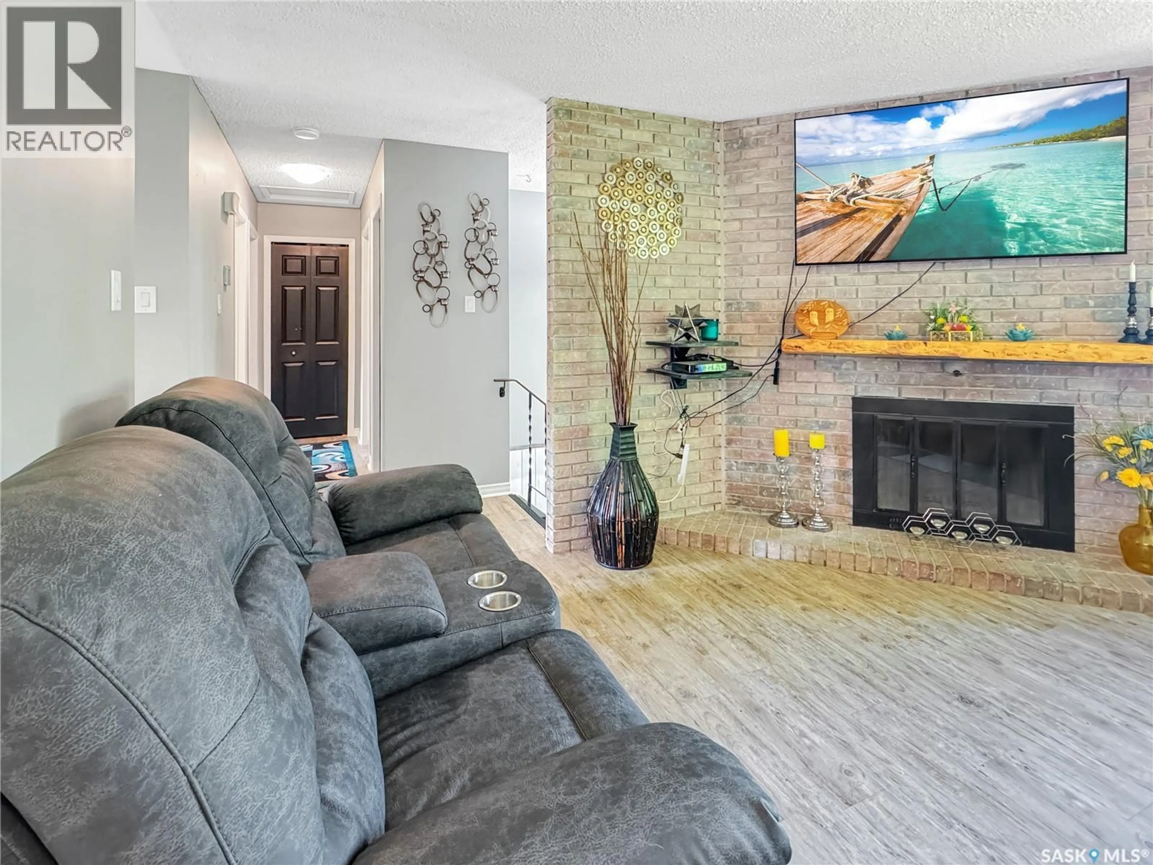 Living room with furniture, ceramic/tile floor for 1772 CENTENNIAL CRESCENT, North Battleford Saskatchewan S9A3J3