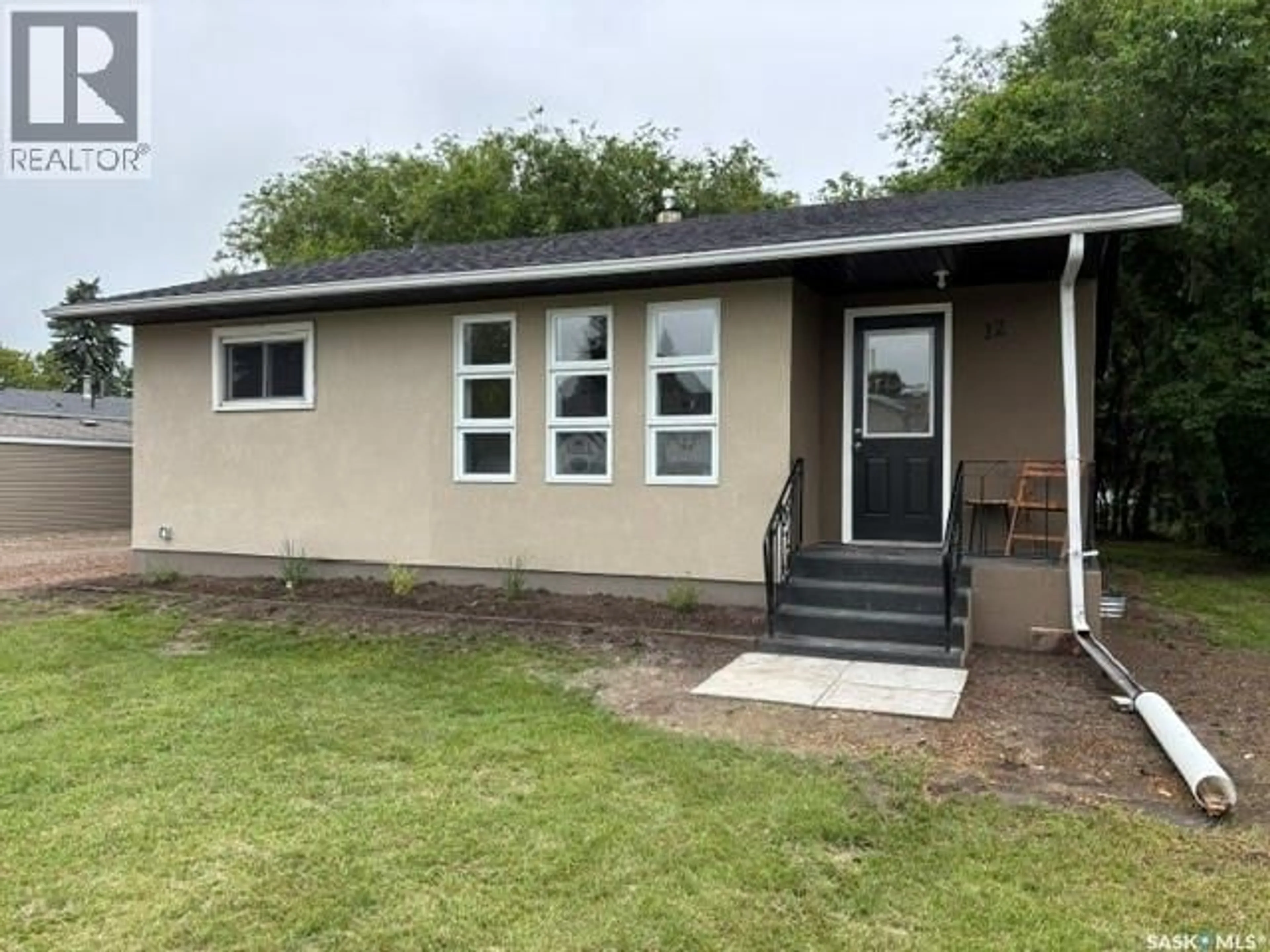 Home with vinyl exterior material, street for 12 ROBERTS STREET, Redvers Saskatchewan S0C2H0