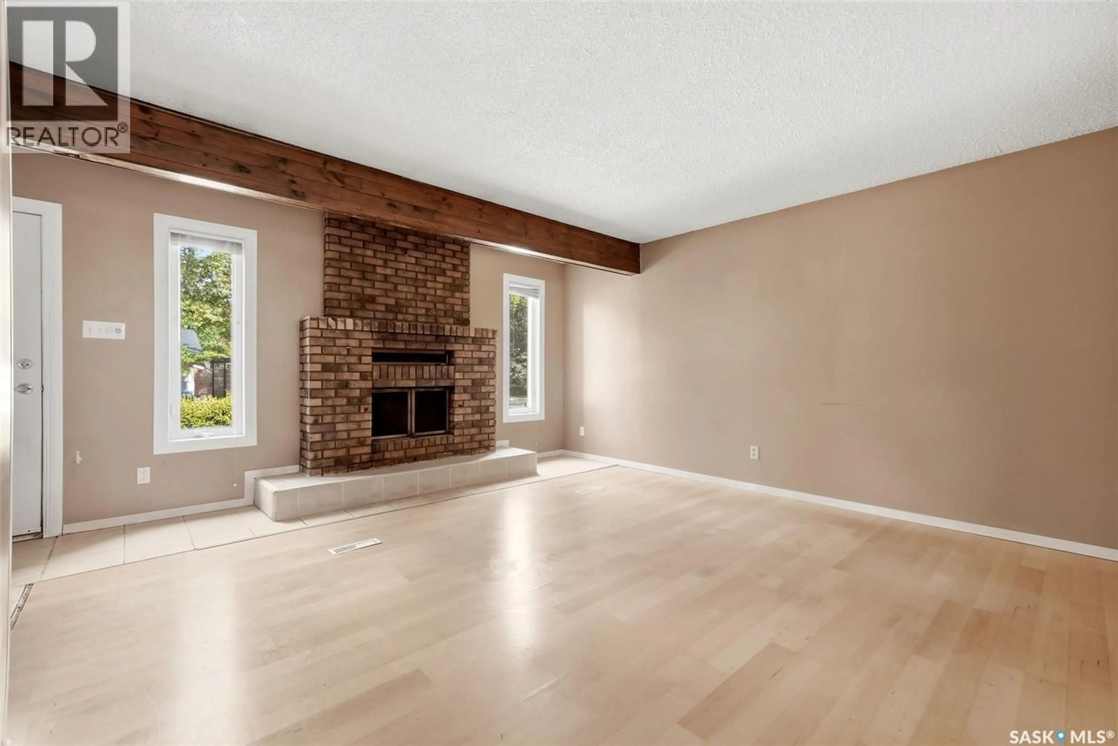 Living room with furniture, wood/laminate floor for 6 OSBORNE CRESCENT, Regina Saskatchewan S4R5J1