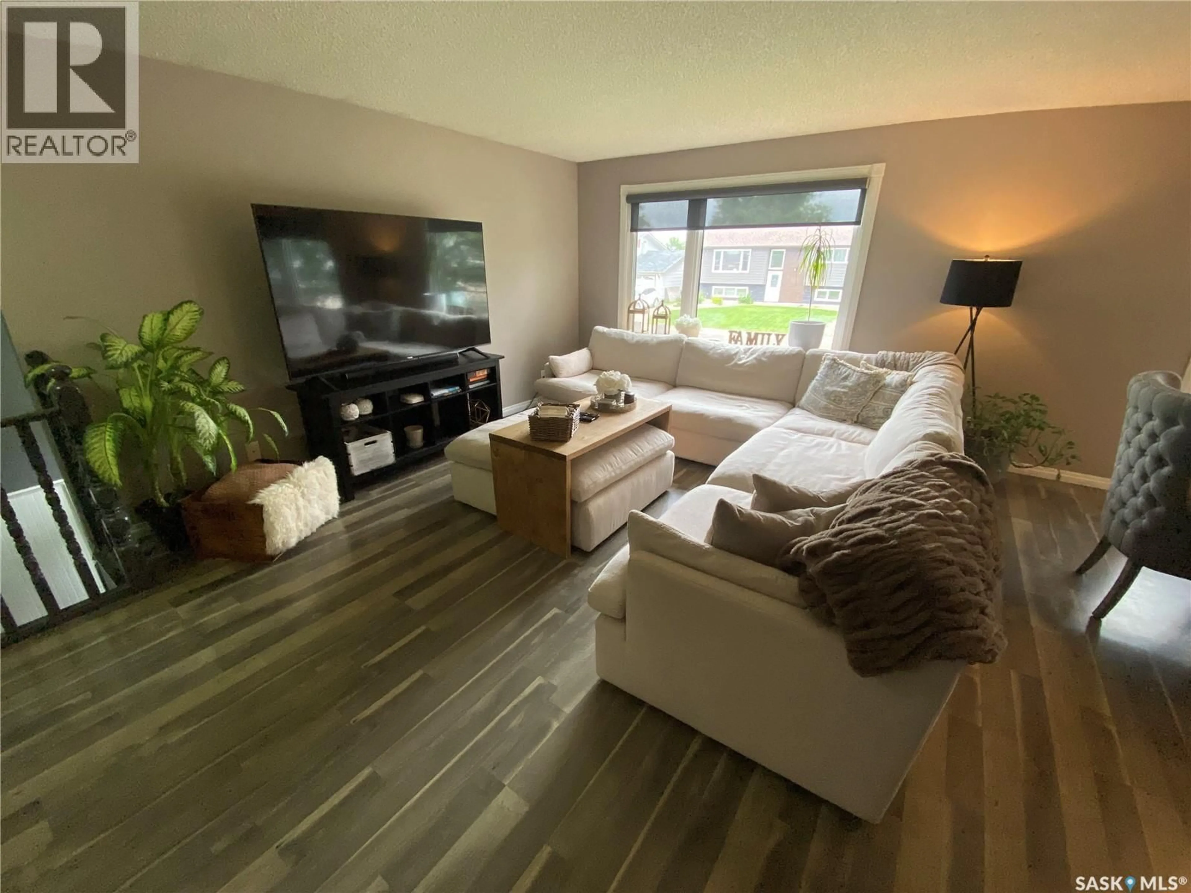 Living room with furniture, wood/laminate floor for 109 STEWART CRESCENT, Yorkton Saskatchewan S3N3J4