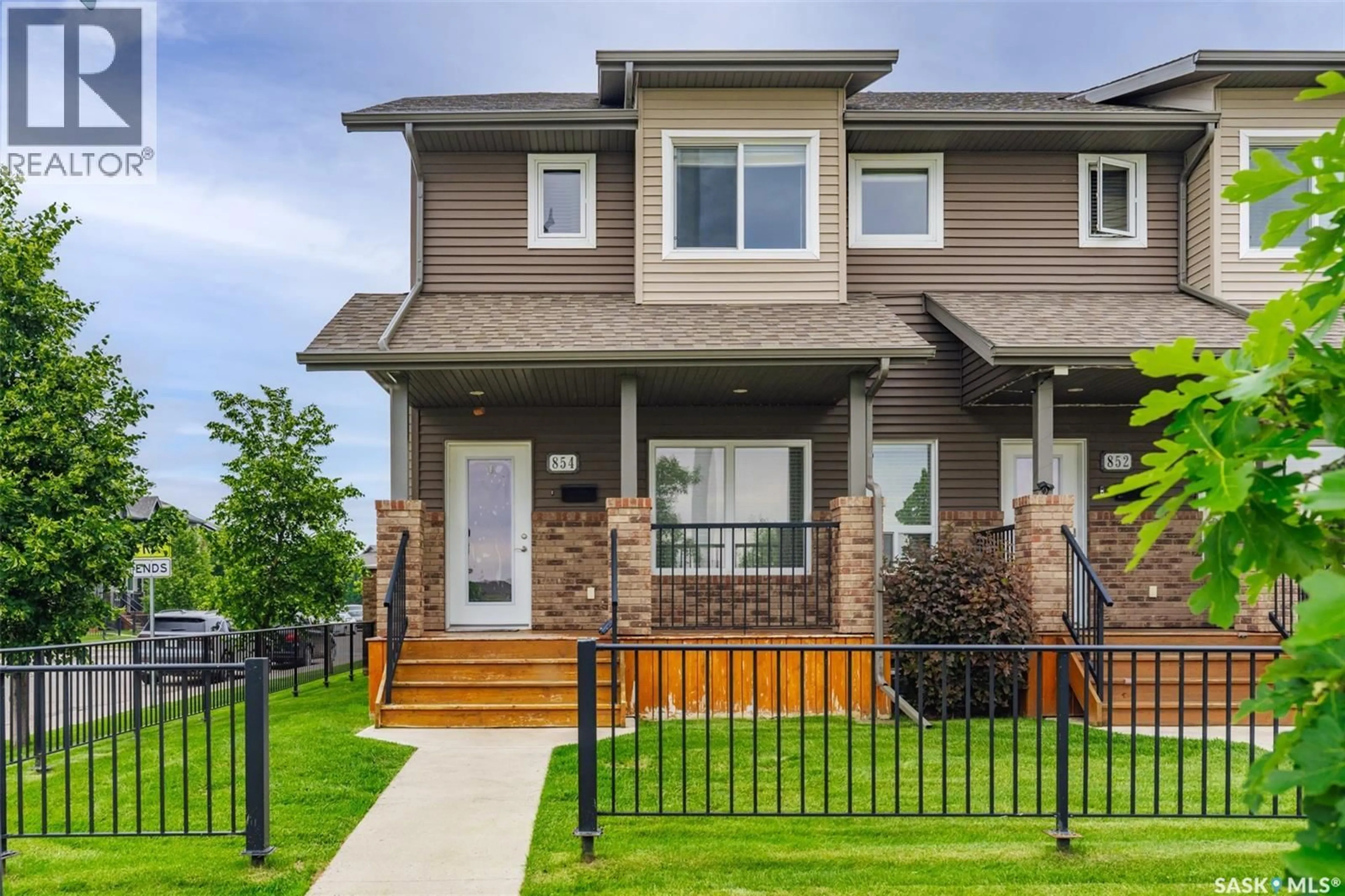 Home with vinyl exterior material, street for 854 STENSRUD ROAD, Saskatoon Saskatchewan S7W0M9