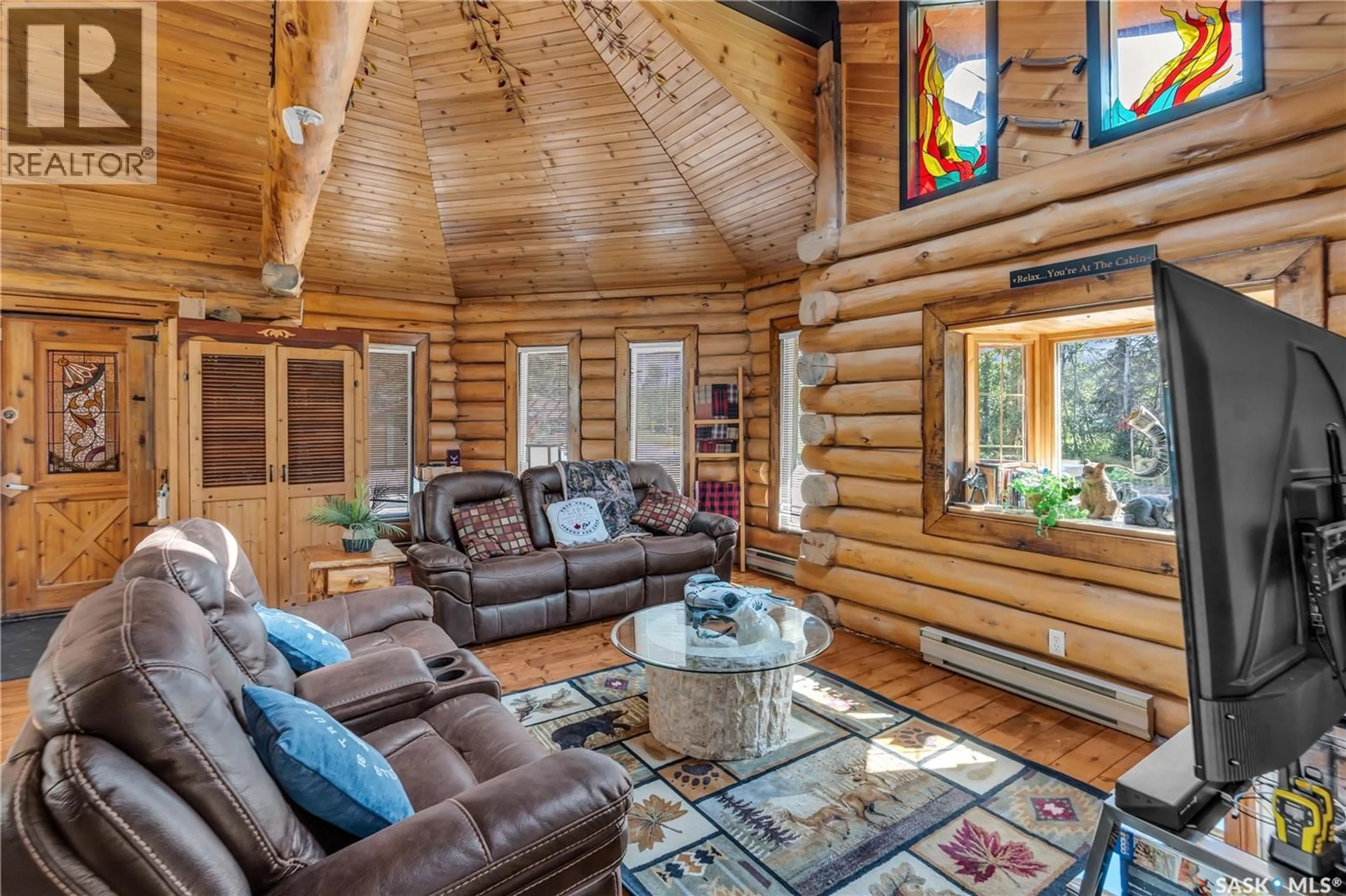 Living room with furniture, wood/laminate floor for 211 AL DRIVE, Turtle Lake Saskatchewan S0M1J0