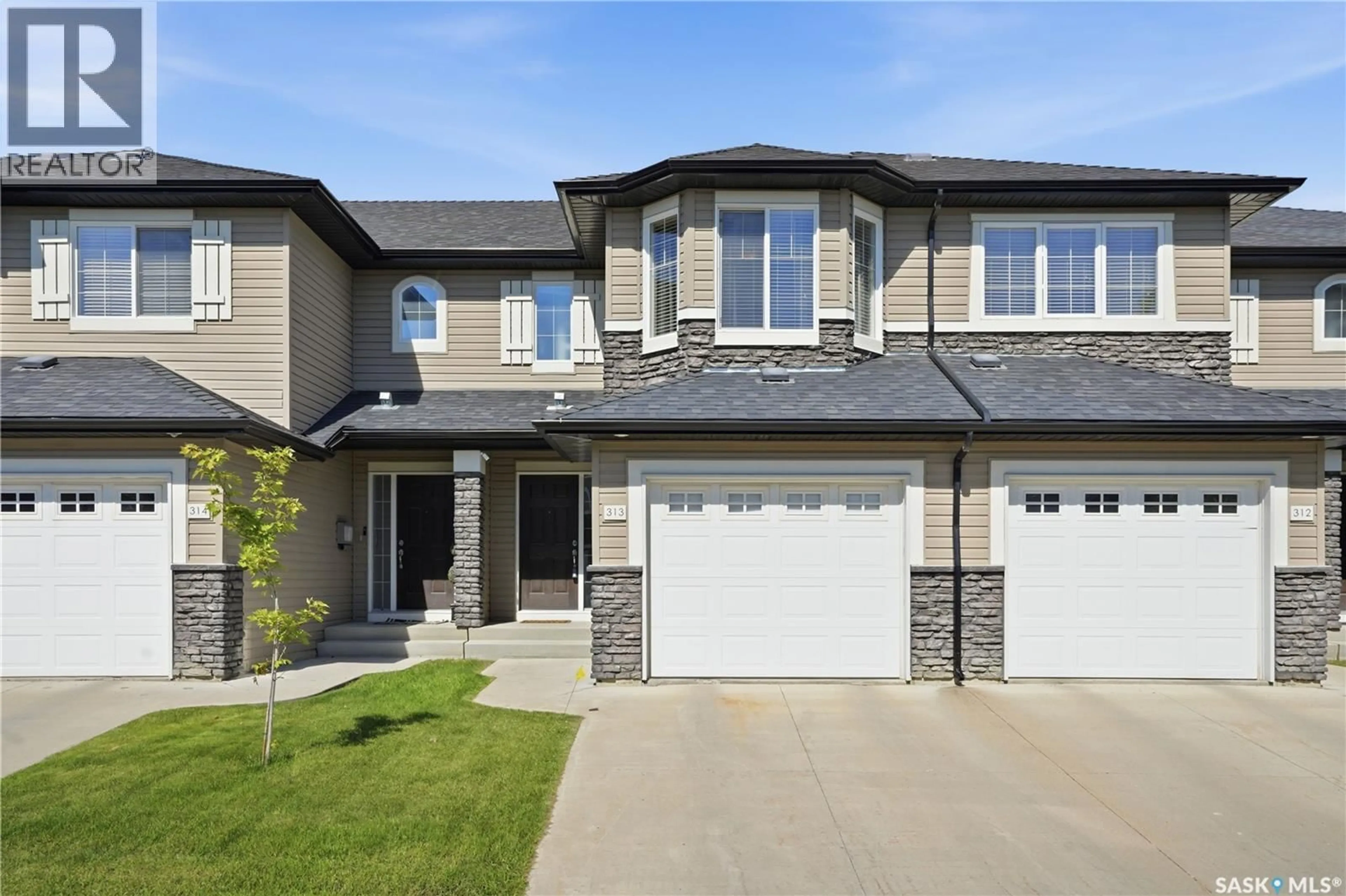 Home with brick exterior material, street for 410 - 313 LEDINGHAM WAY, Saskatoon Saskatchewan S7V0C4