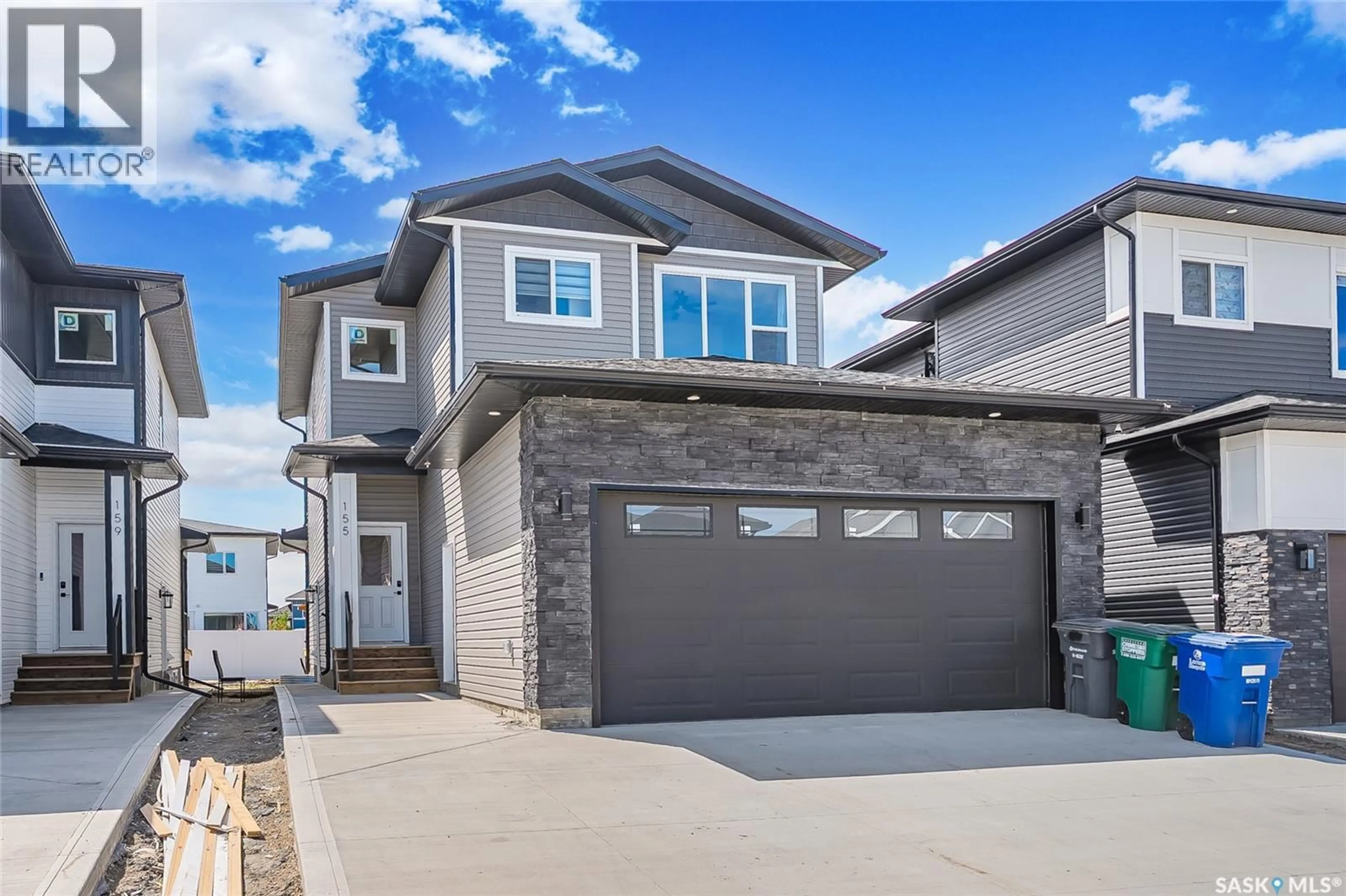 Home with vinyl exterior material, street for 155 SCHMEISER LANE, Saskatoon Saskatchewan S7V1P1