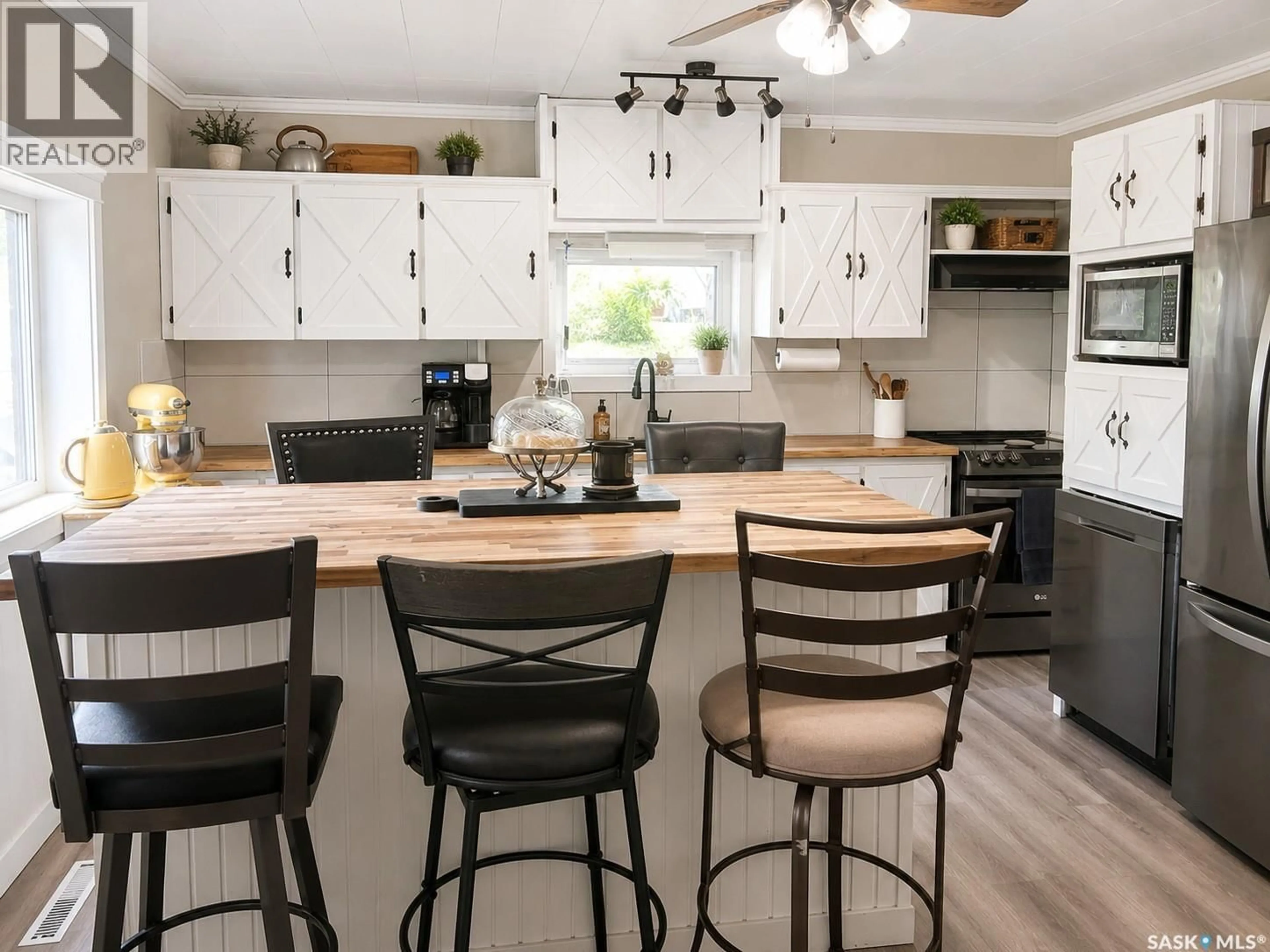 Open concept kitchen, wood/laminate floor for WHITE ACREAGE, Canwood Rm No. 494 Saskatchewan S0J2E0