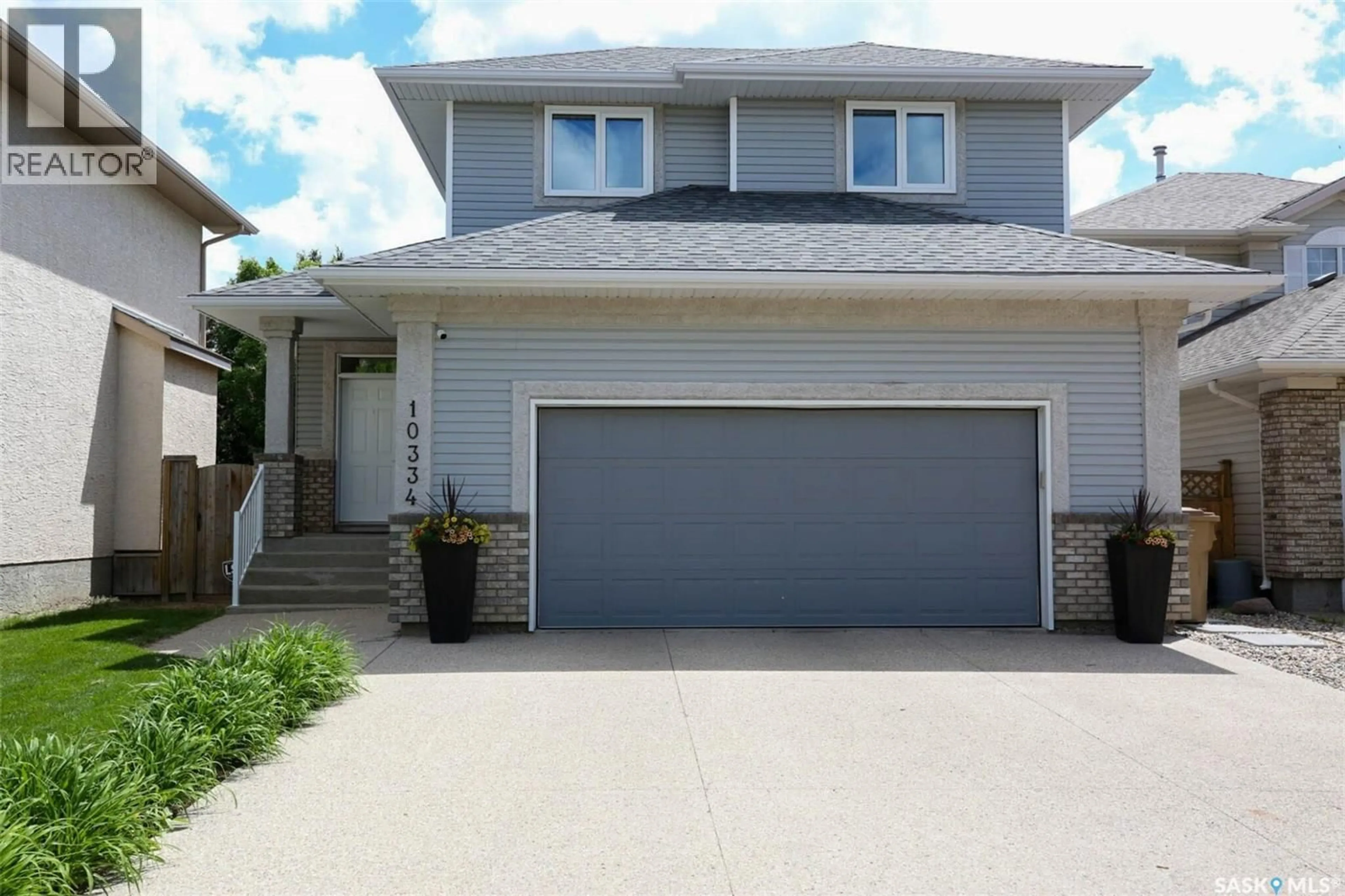 Home with vinyl exterior material, street for 10334 WASCANA ESTATES, Regina Saskatchewan S4V2X1