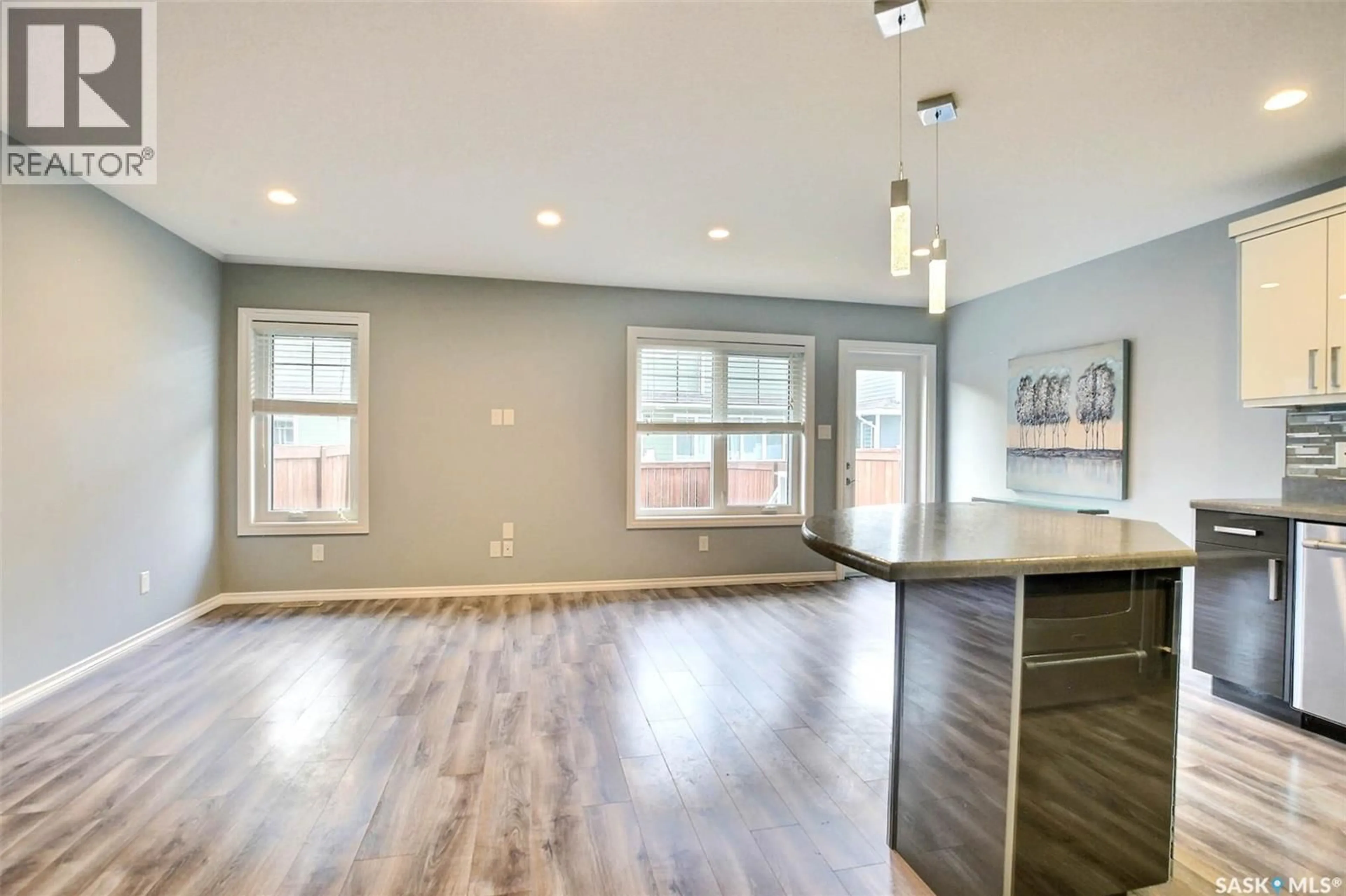 Open concept kitchen, wood/laminate floor for 217 - 4002 SANDHILL CRESCENT, Regina Saskatchewan S4V3J1
