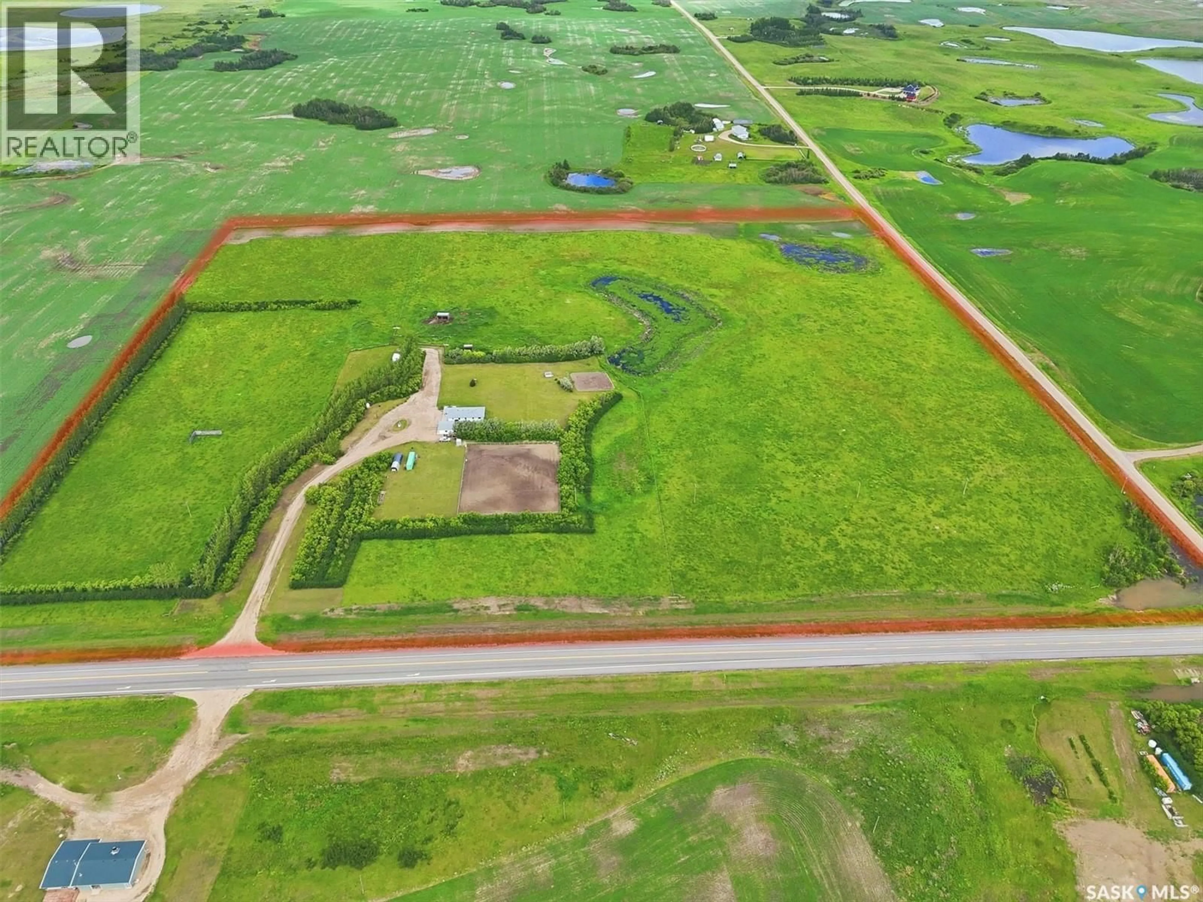 A pic from outside/outdoor area/front of a property/back of a property/a pic from drone, building for 17515 HIGHWAY 5 ACREAGE, Aberdeen Rm No. 373 Saskatchewan S7A0A9