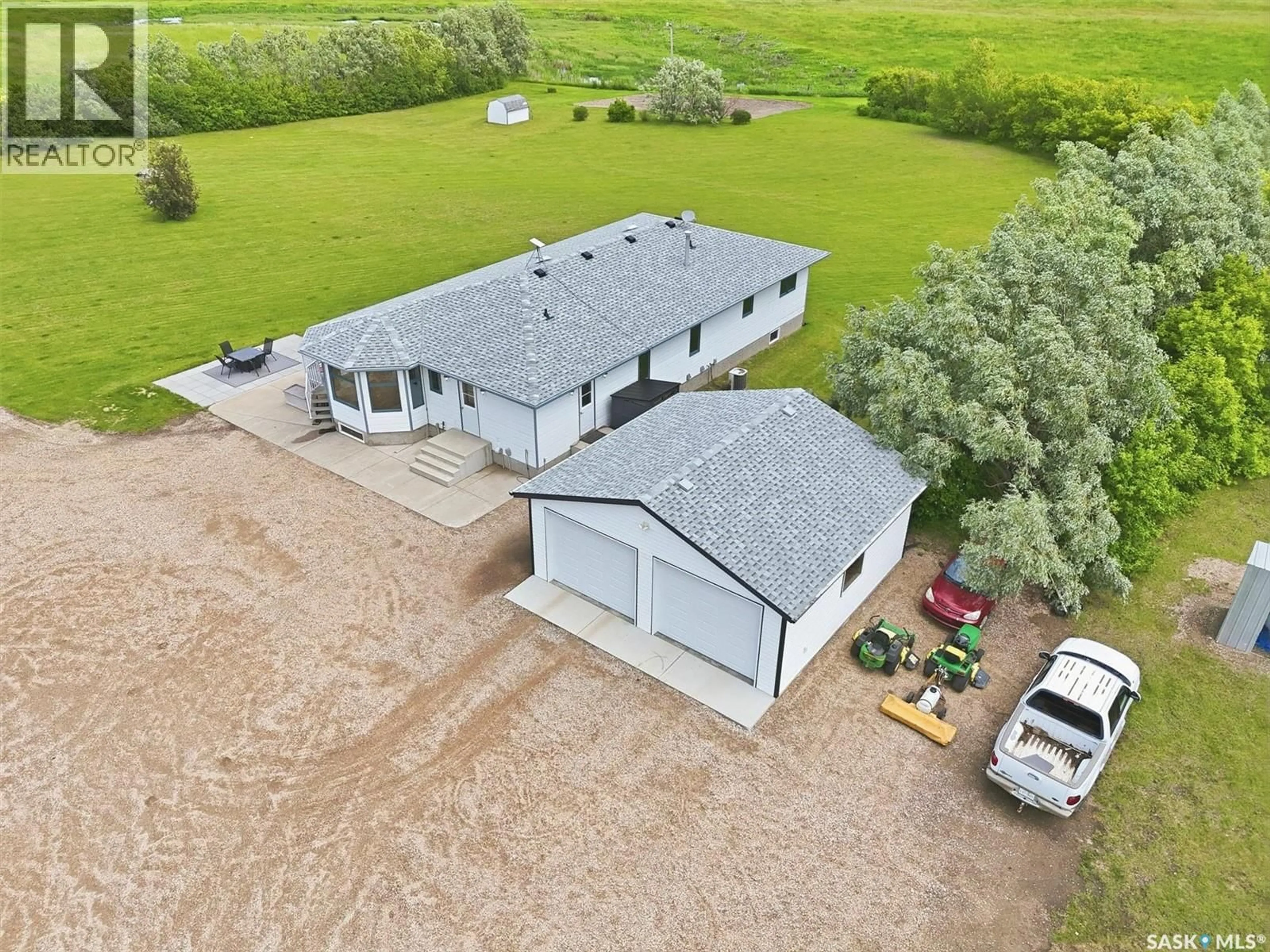 A pic from outside/outdoor area/front of a property/back of a property/a pic from drone, building for 17515 HIGHWAY 5 ACREAGE, Aberdeen Rm No. 373 Saskatchewan S7A0A9