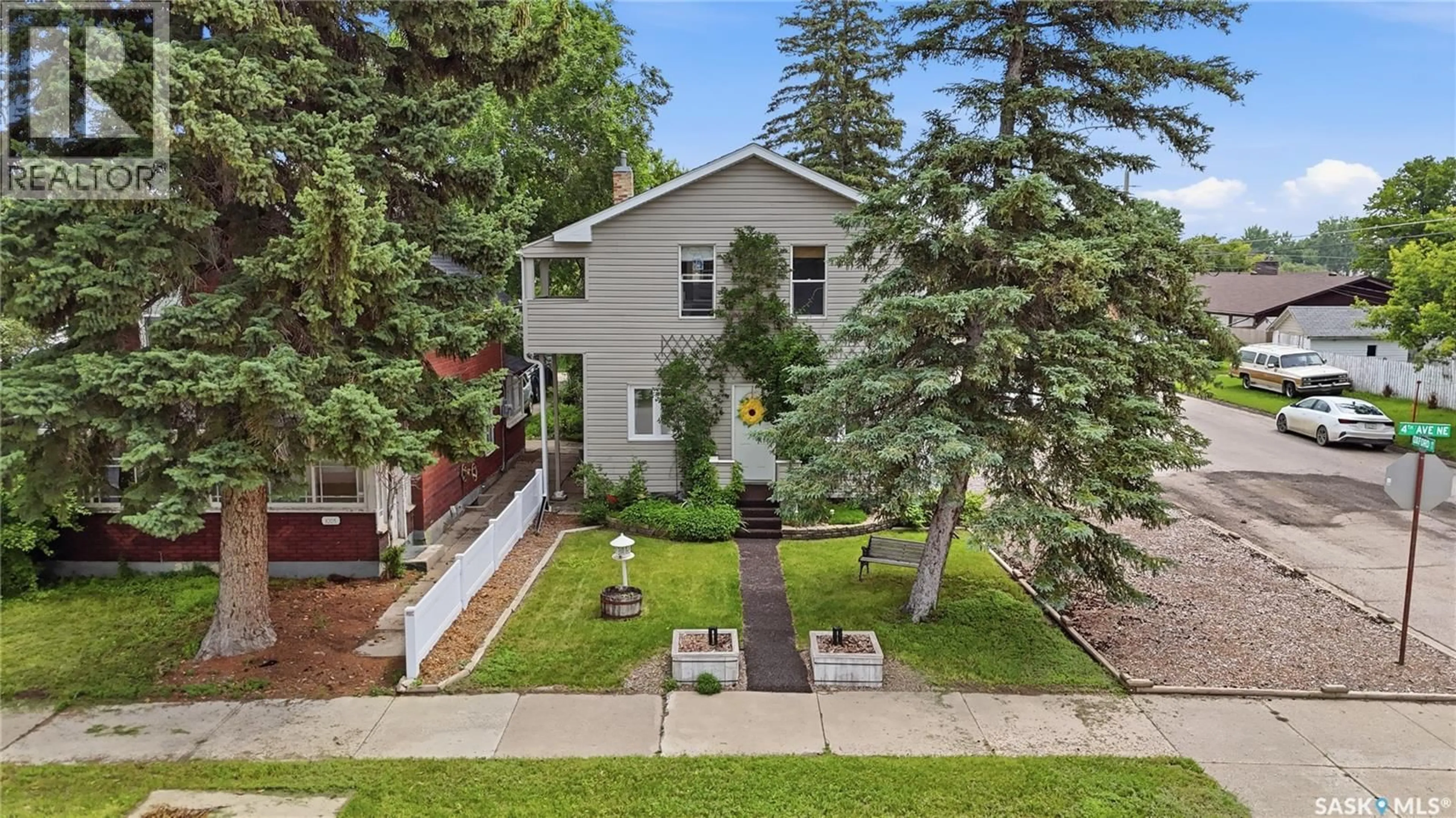 A pic from outside/outdoor area/front of a property/back of a property/a pic from drone, street for 1001 4TH AVENUE, Moose Jaw Saskatchewan S6H1H9