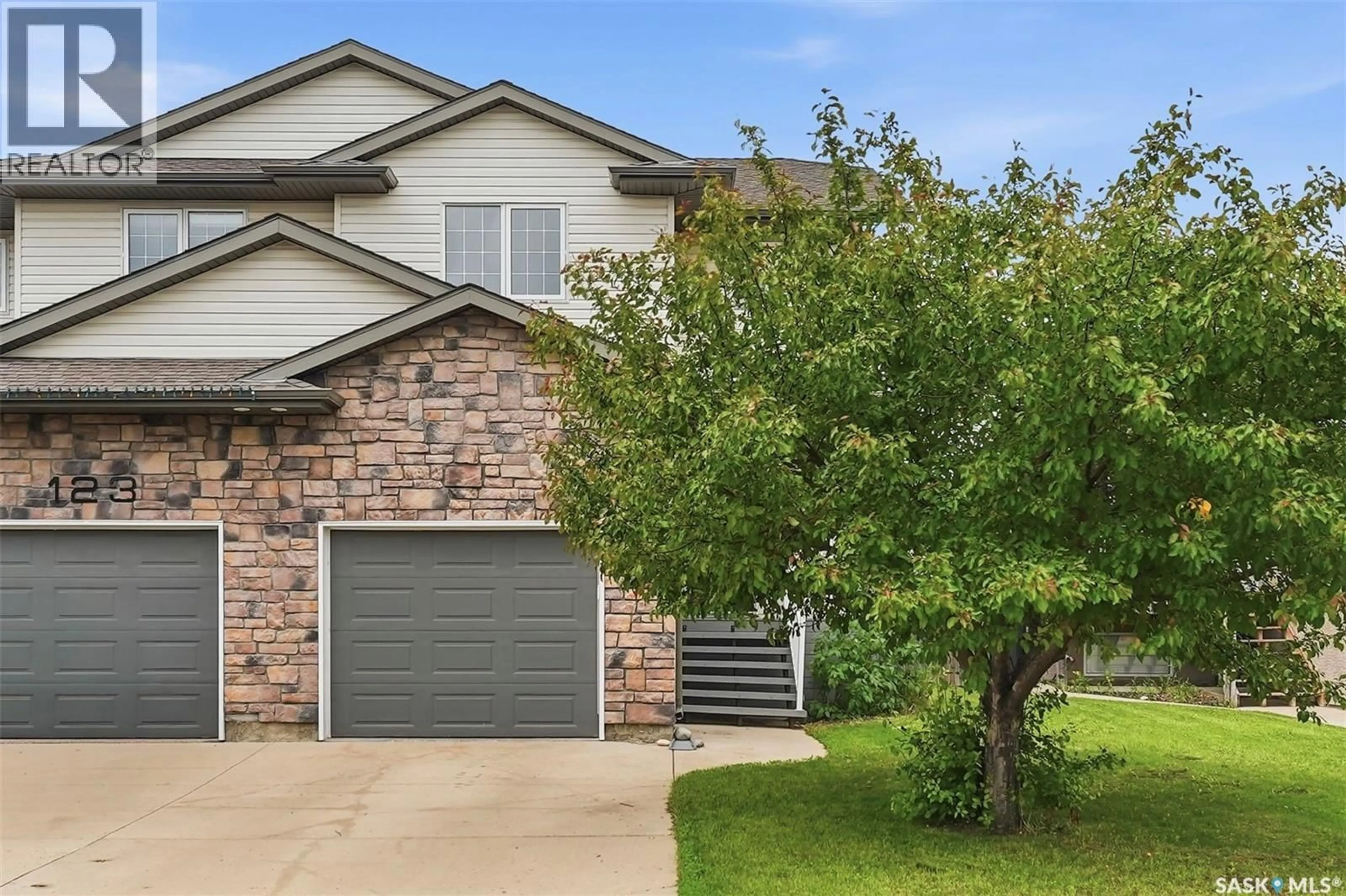 Home with brick exterior material, street for 125 MEADOWLARK PARK, Warman Saskatchewan S0K0A1