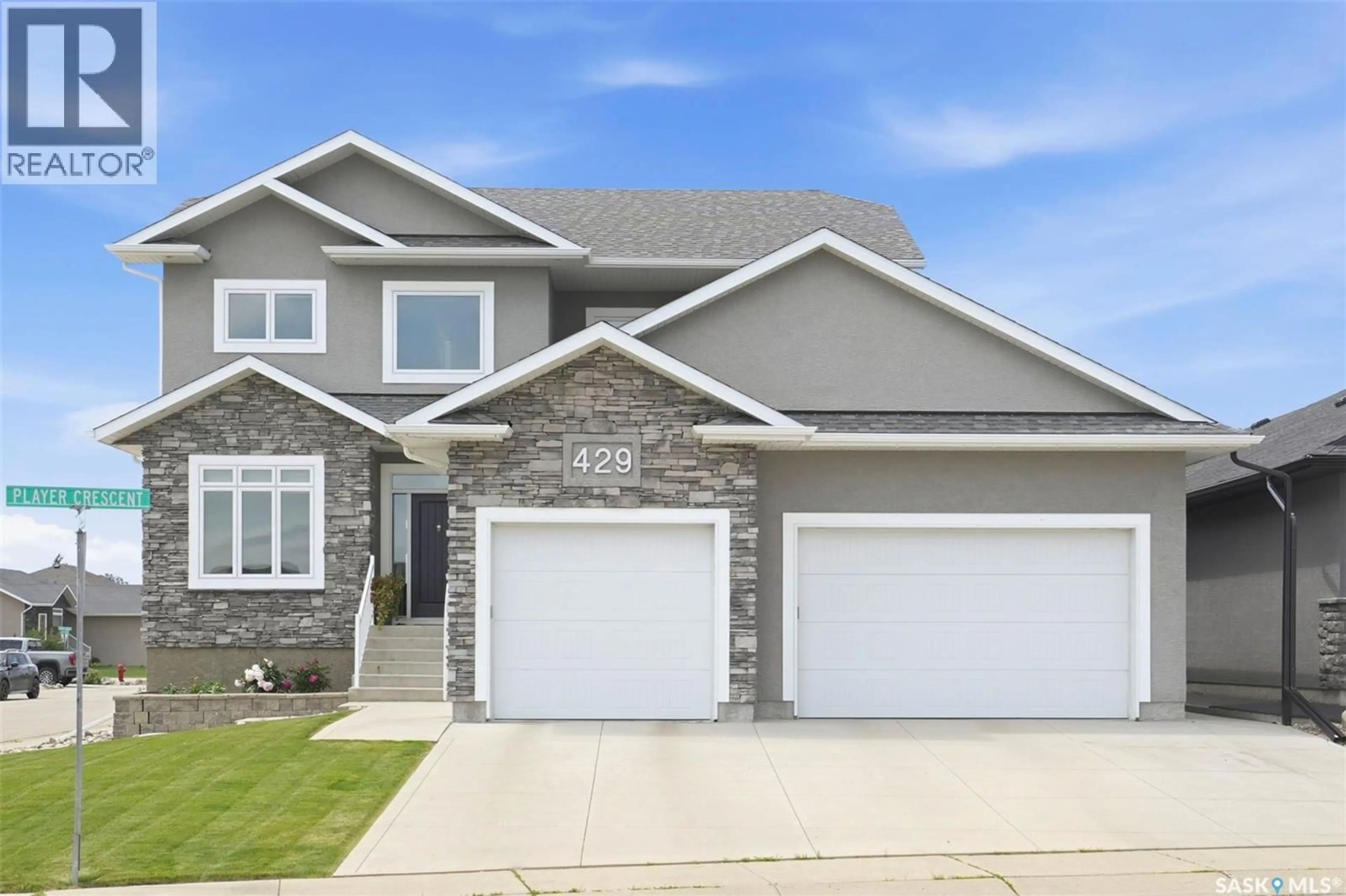 Home with vinyl exterior material, street for 429 PLAYER CRESCENT, Warman Saskatchewan S0K4S1