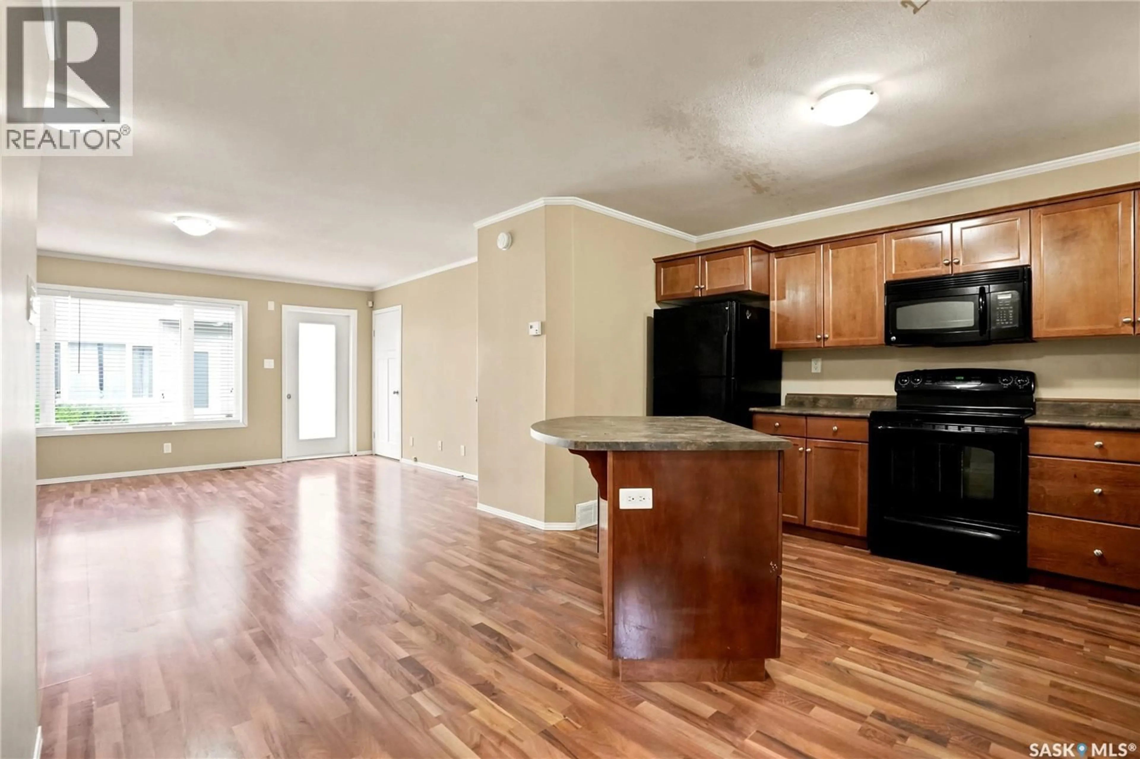 Open concept kitchen, wood/laminate floor for 715 - 403 HART ROAD, Saskatoon Saskatchewan S7M3Y7