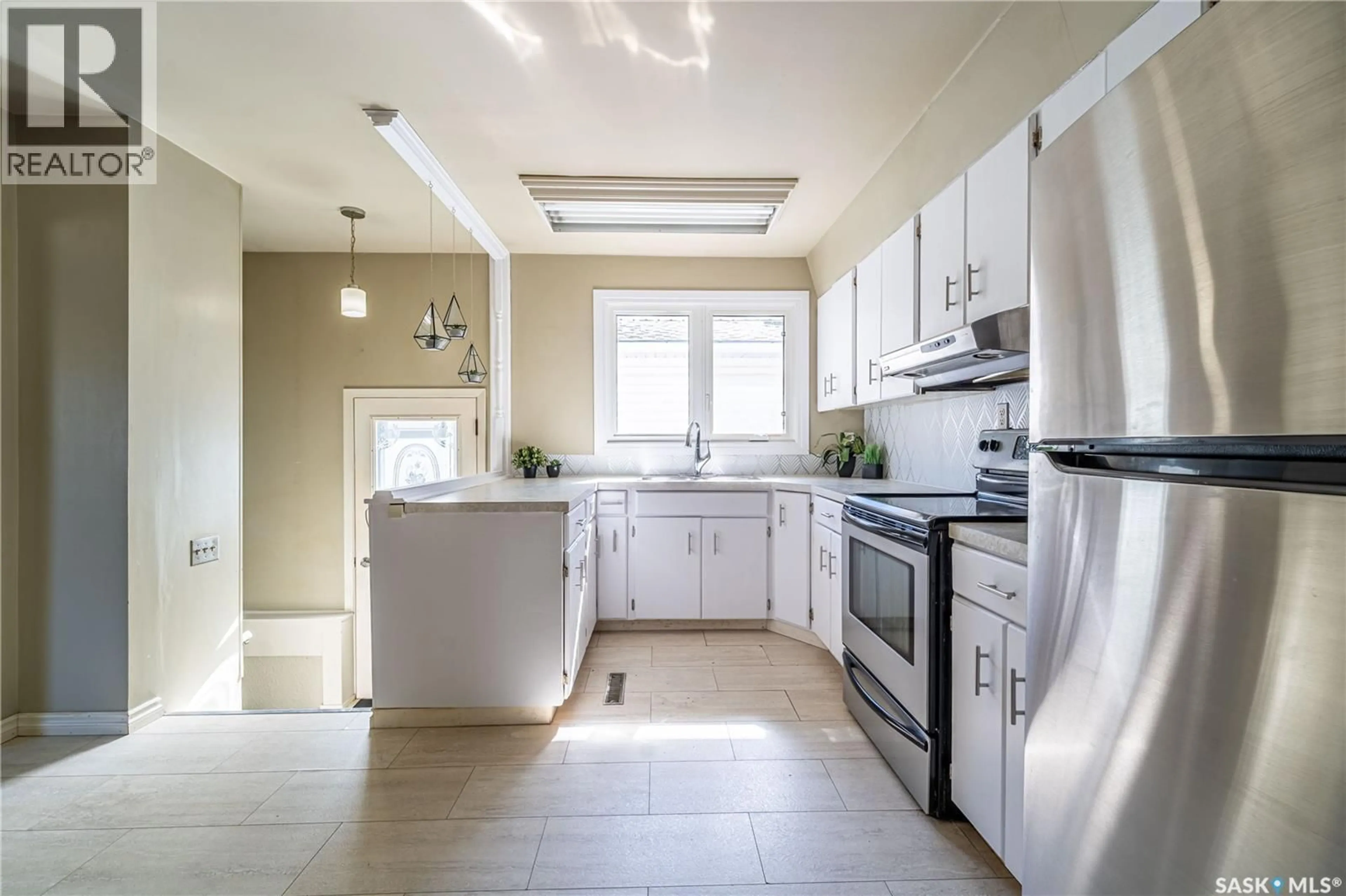Open concept kitchen, ceramic/tile floor for 1014 HOPKINS CRESCENT, Moose Jaw Saskatchewan S6H3E7