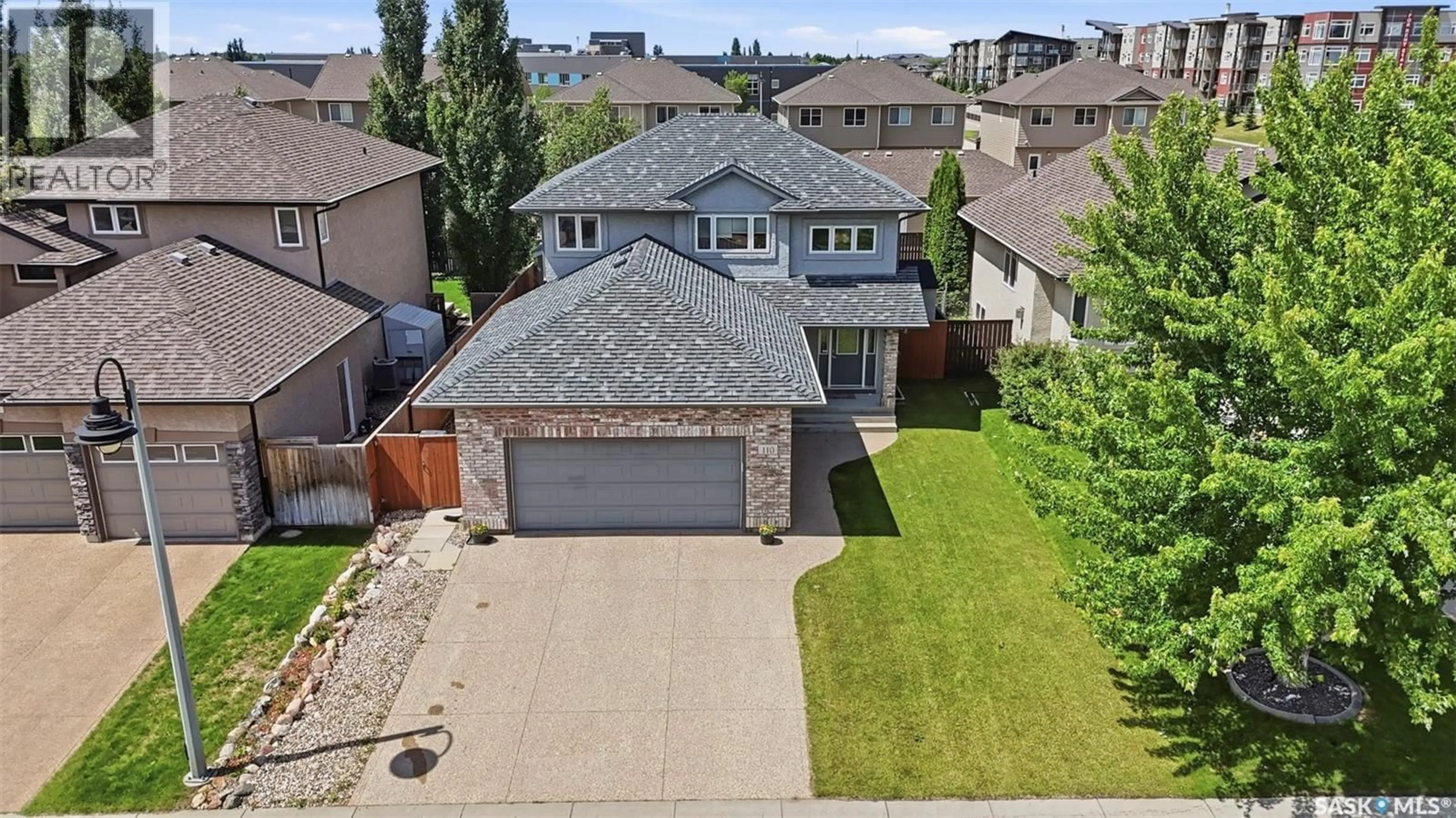 A pic from outside/outdoor area/front of a property/back of a property/a pic from drone, street for 110 ROBERTSON COVE, Saskatoon Saskatchewan S7T0E3
