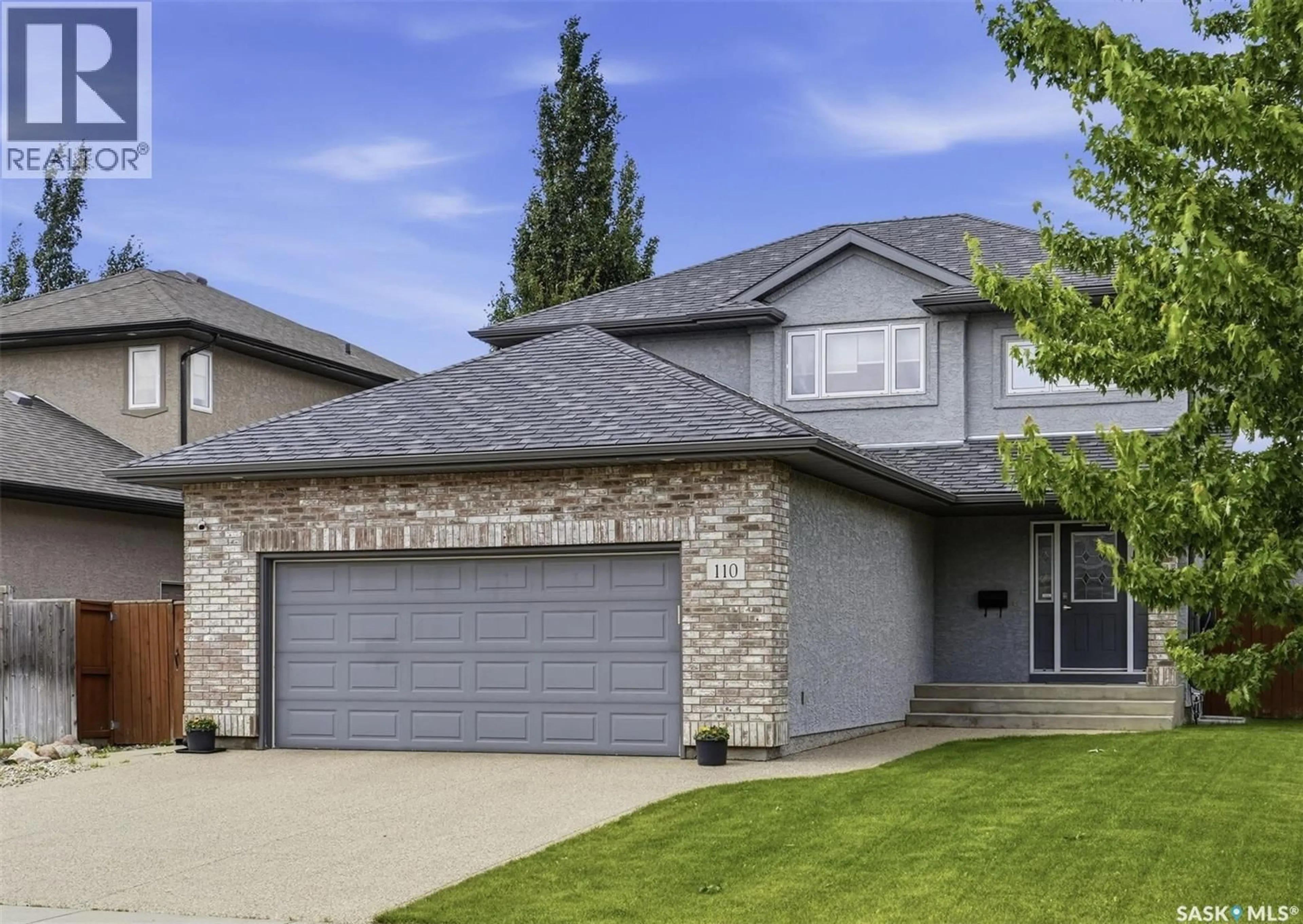 Home with brick exterior material, street for 110 ROBERTSON COVE, Saskatoon Saskatchewan S7T0E3
