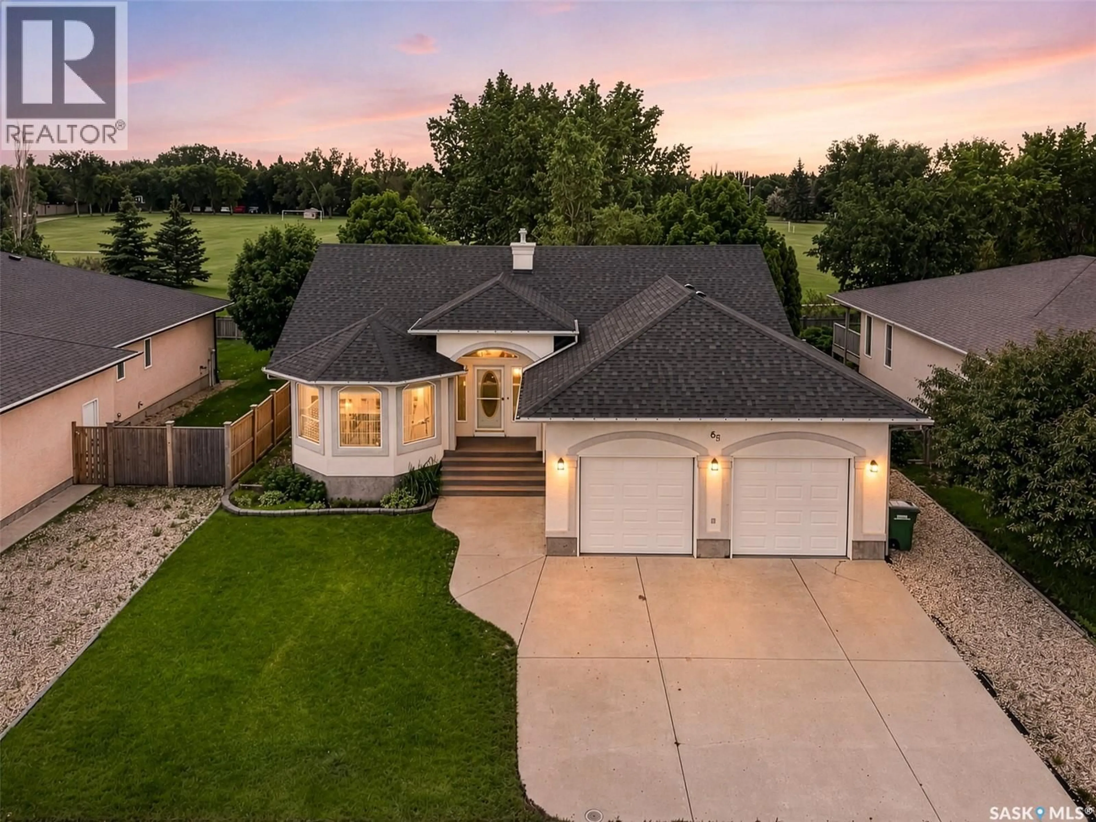 A pic from outside/outdoor area/front of a property/back of a property/a pic from drone, street for 65 FLAX ROAD, Moose Jaw Saskatchewan S6J1L1