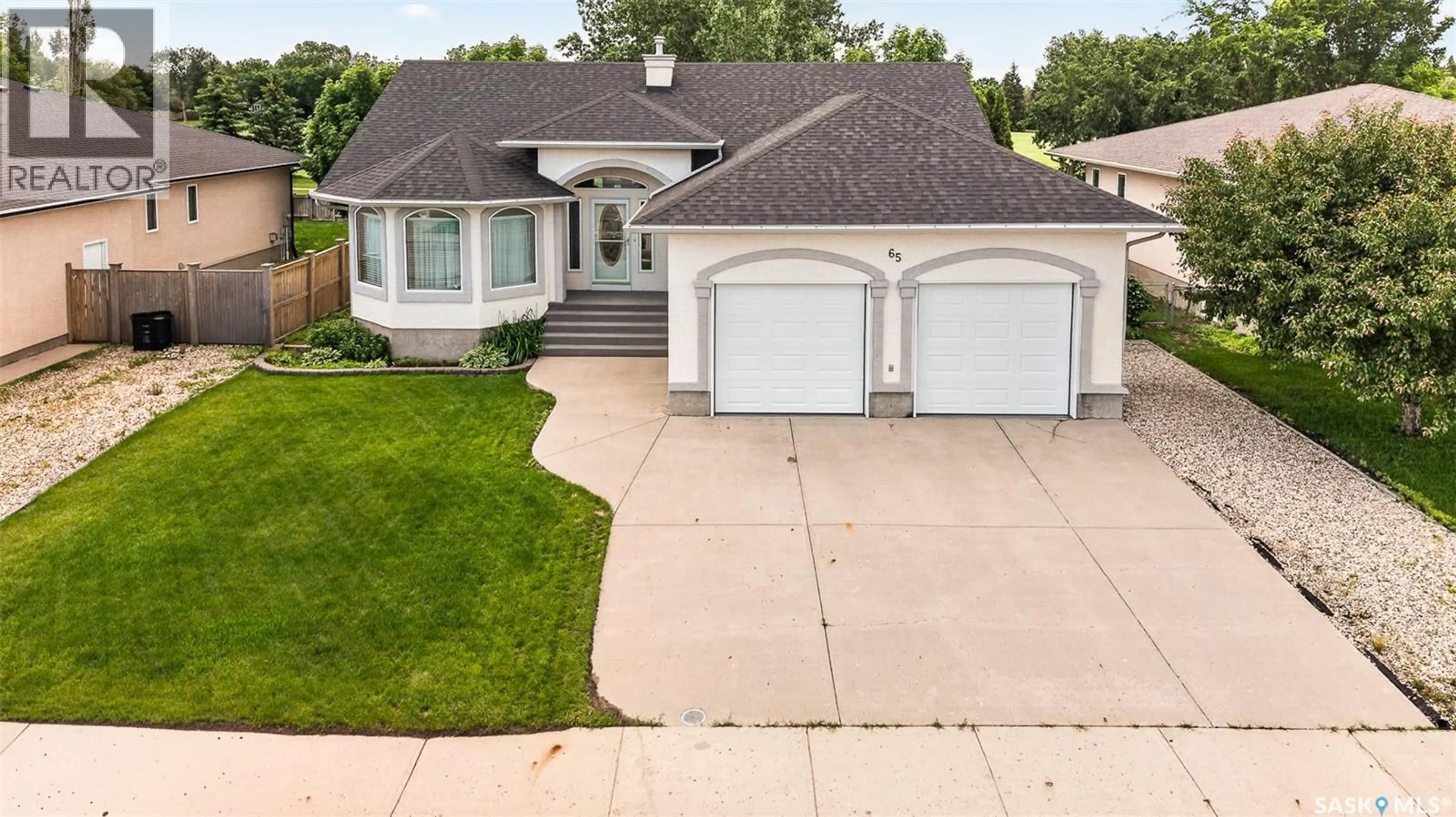 Home with vinyl exterior material, street for 65 FLAX ROAD, Moose Jaw Saskatchewan S6J1L1