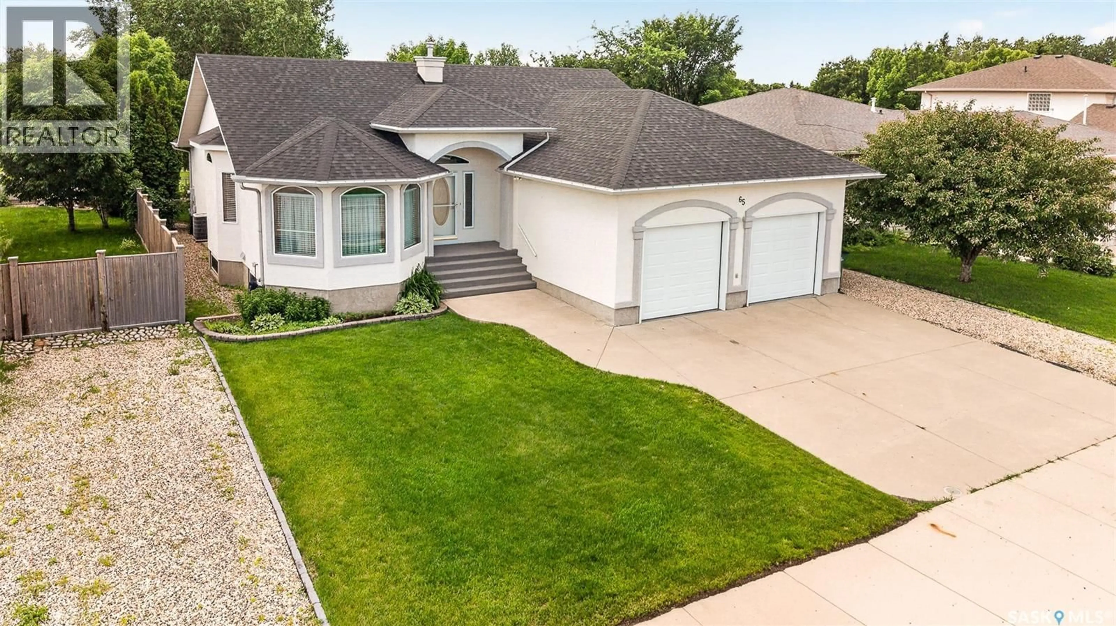 Home with vinyl exterior material, street for 65 FLAX ROAD, Moose Jaw Saskatchewan S6J1L1