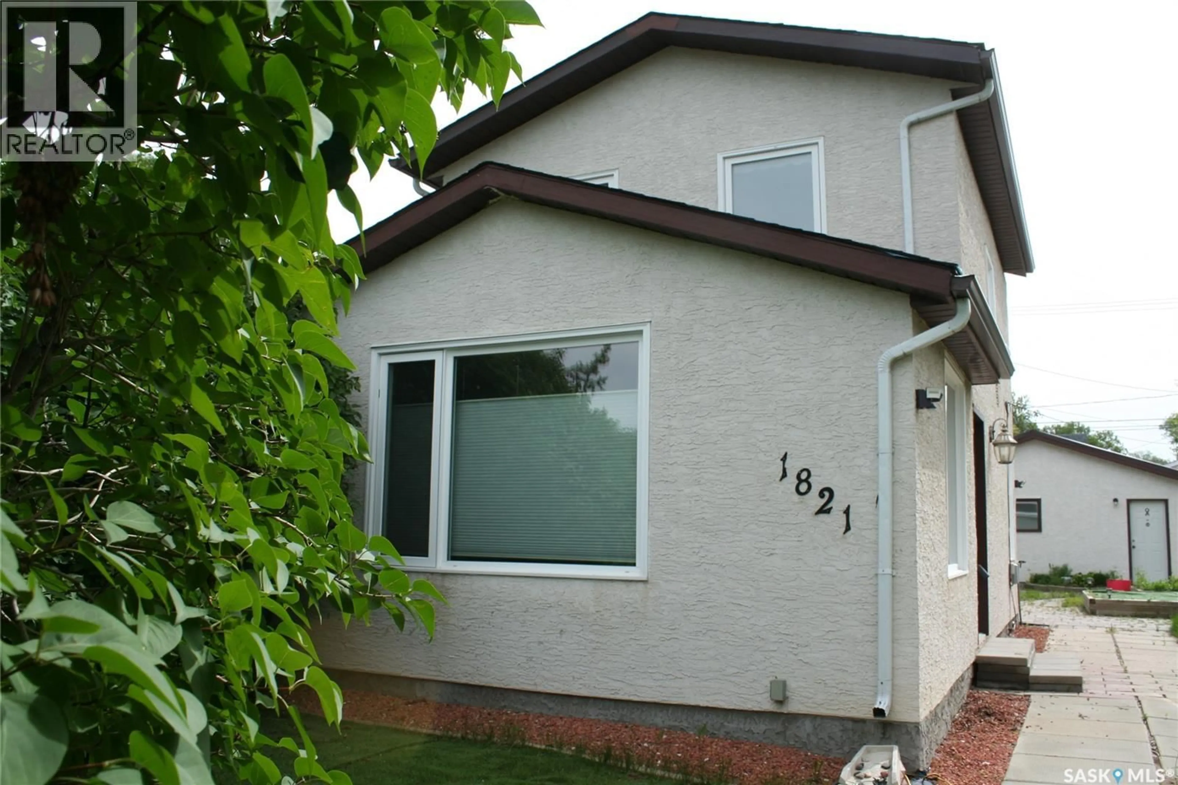 Home with vinyl exterior material, street for 1821 CONNAUGHT STREET, Regina Saskatchewan S4T4T4