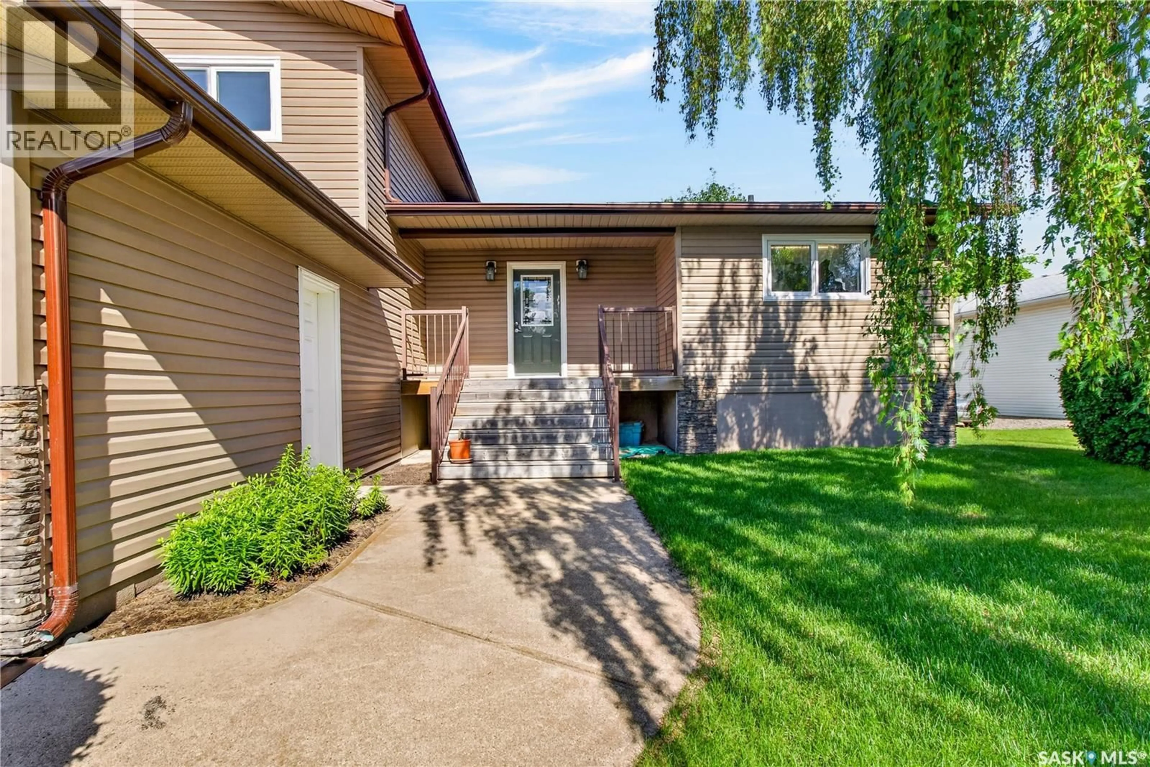 Home with vinyl exterior material, street for 1112 11TH STREET, Humboldt Saskatchewan S0K2A0