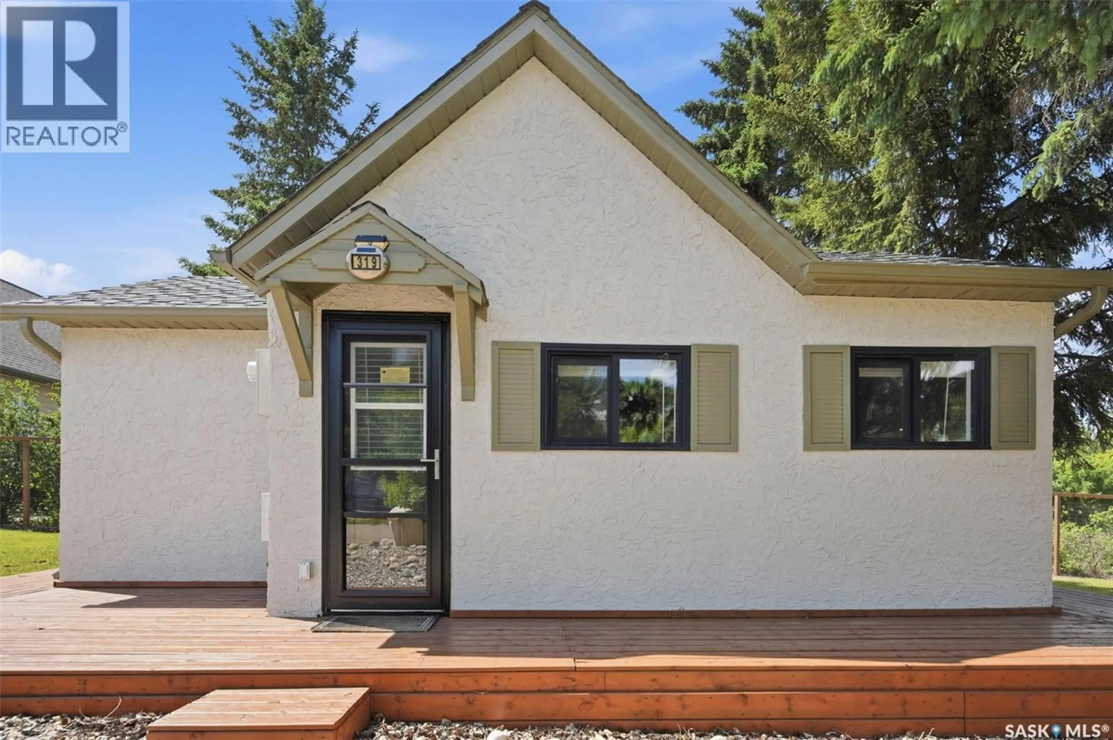 Home with vinyl exterior material, street for 319 CUMMING AVENUE, Manitou Beach Saskatchewan S0K4T1