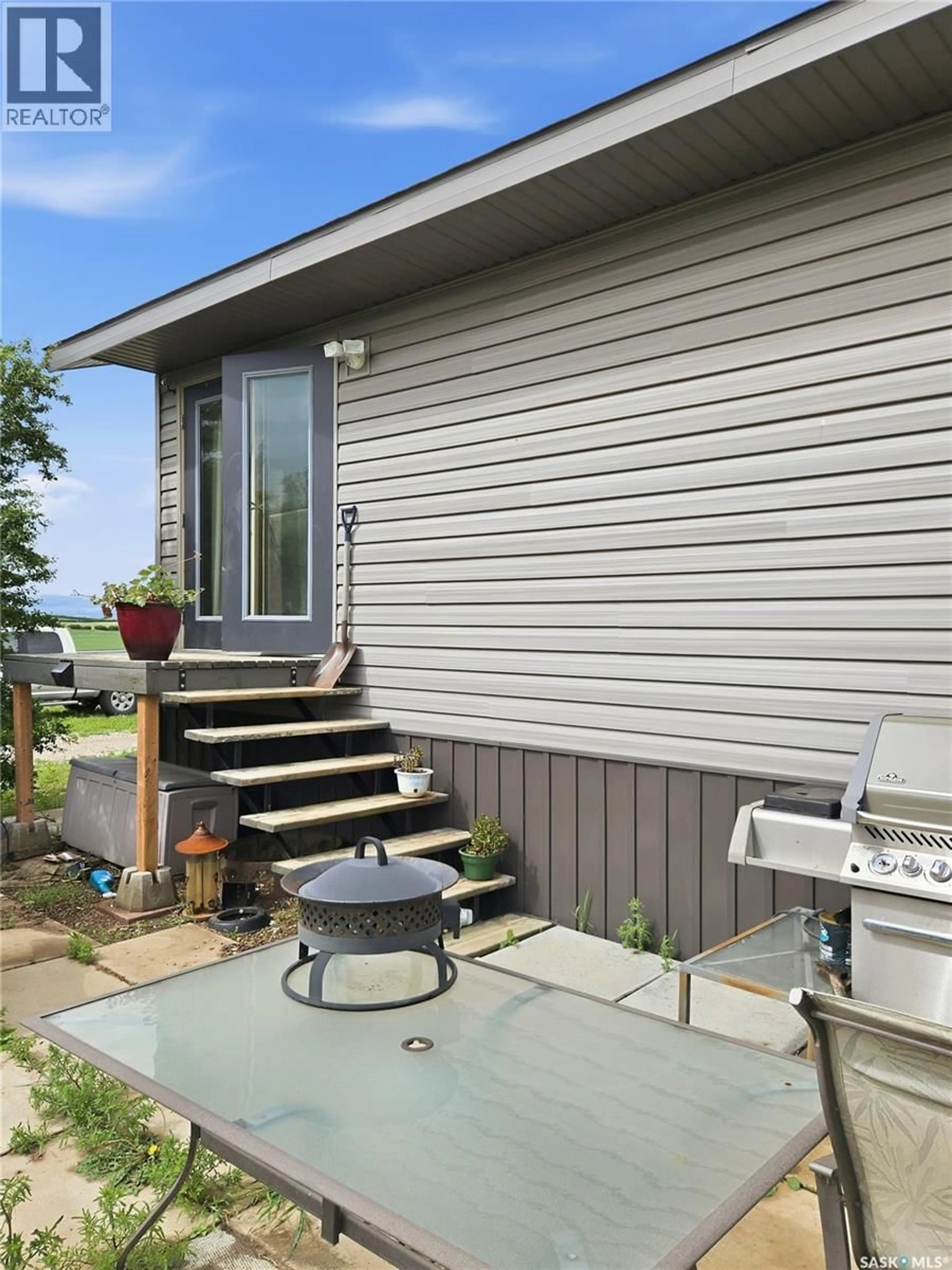 Home with vinyl exterior material, street for DOLL ACREAGE, Dodsland Saskatchewan S0L0V0