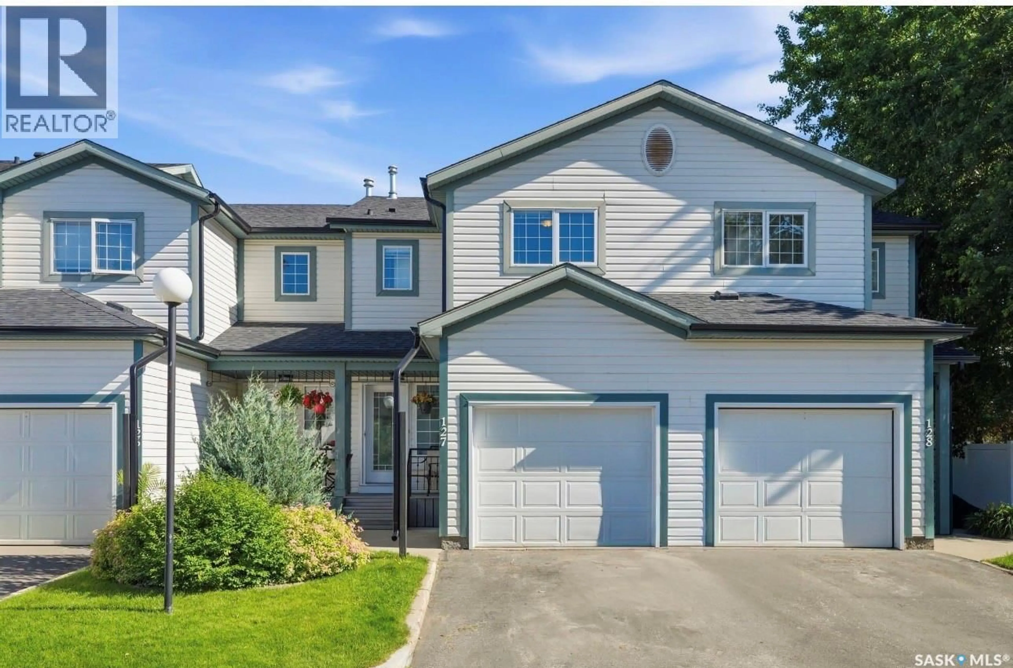 Home with vinyl exterior material, street for 127 535 MCWILLIE AVENUE, Saskatoon Saskatchewan S7S1J1