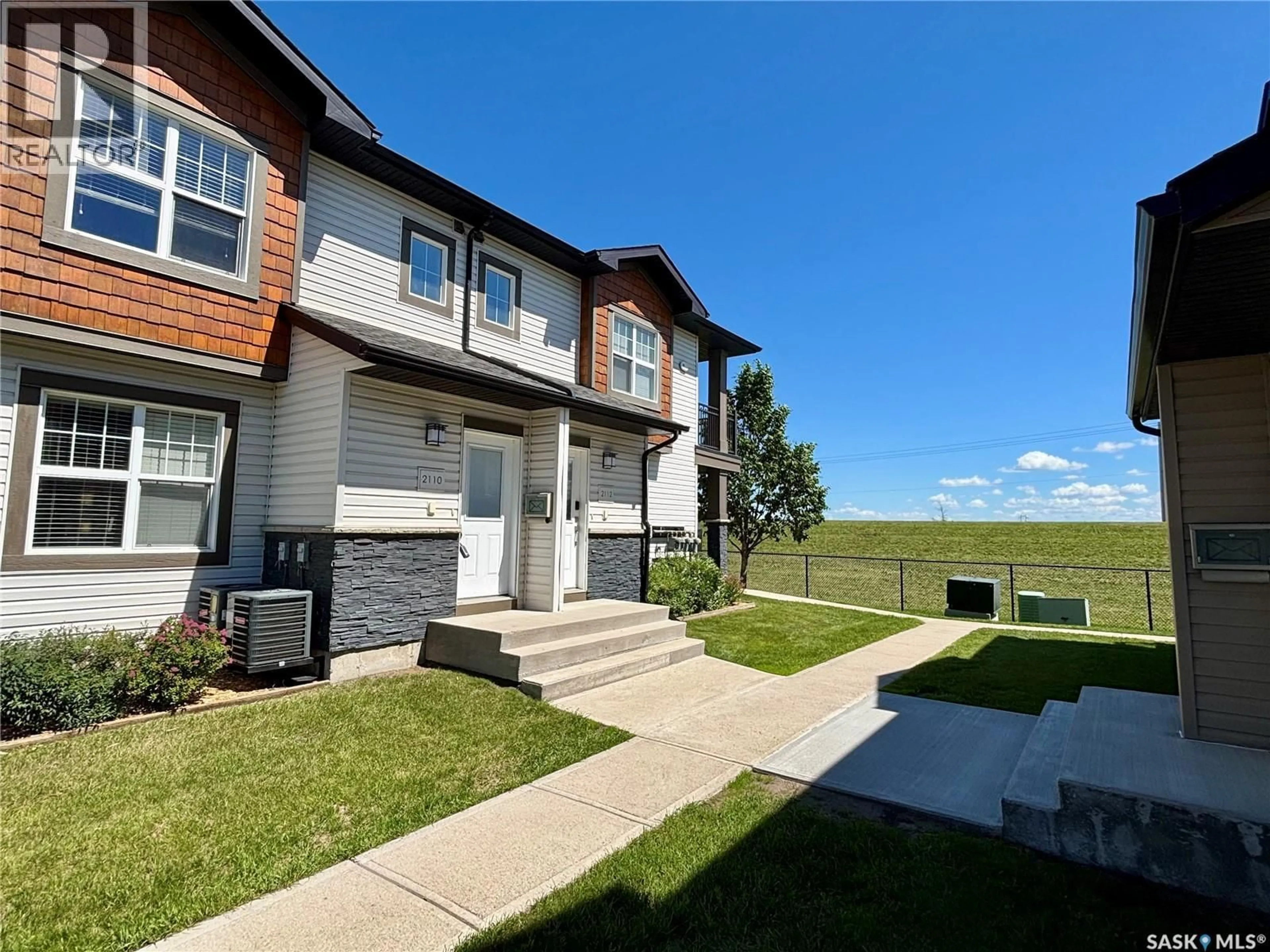 A pic from outside/outdoor area/front of a property/back of a property/a pic from drone, unknown for 1015 - 2110 PATRICK CRESCENT, Saskatoon Saskatchewan S7W0M2