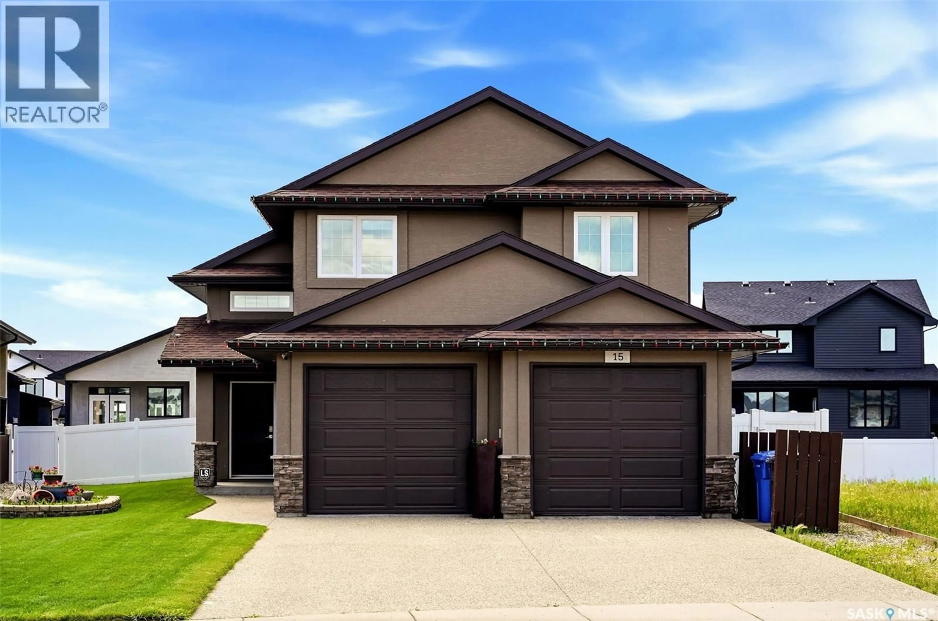 Home with vinyl exterior material, street for 15 HUDSON DRIVE, Pilot Butte Saskatchewan S0G3Z0