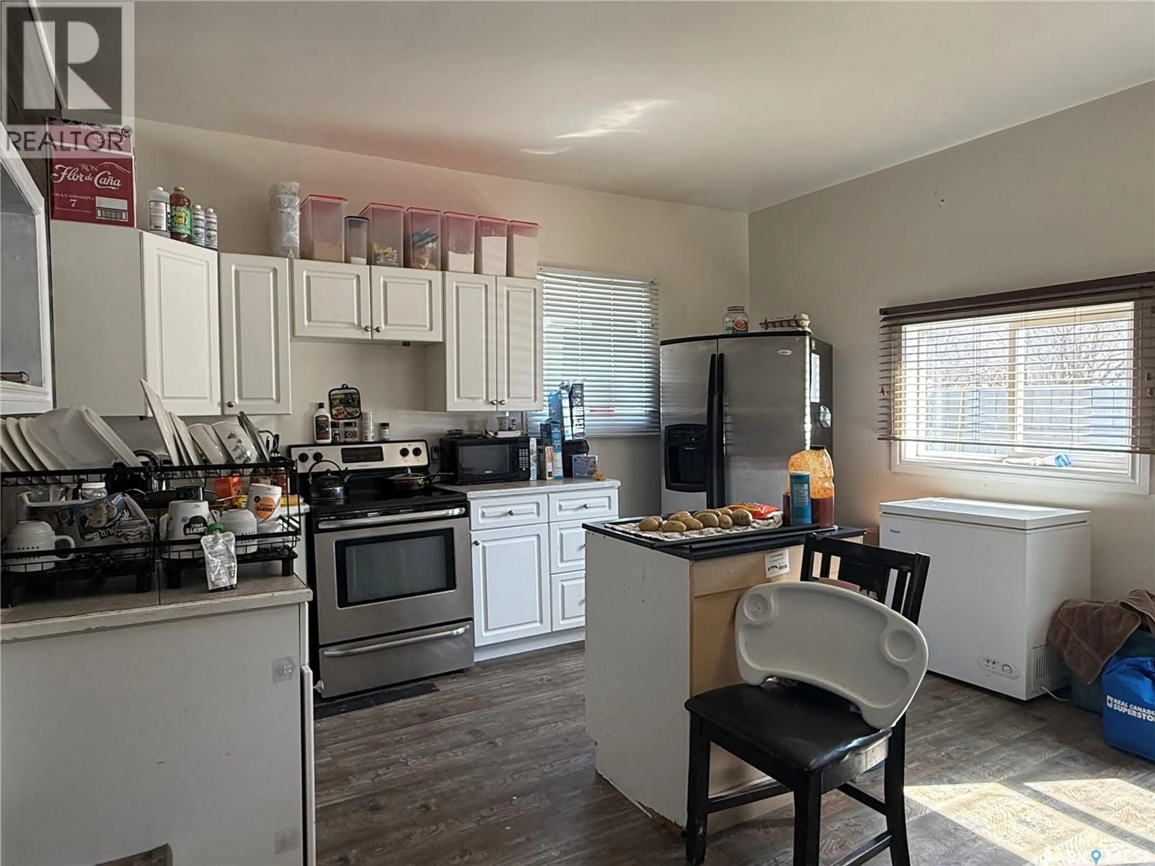Open concept kitchen, wood/laminate floor for 707 RAILWAY AVENUE, Neudorf Saskatchewan S0A2T0