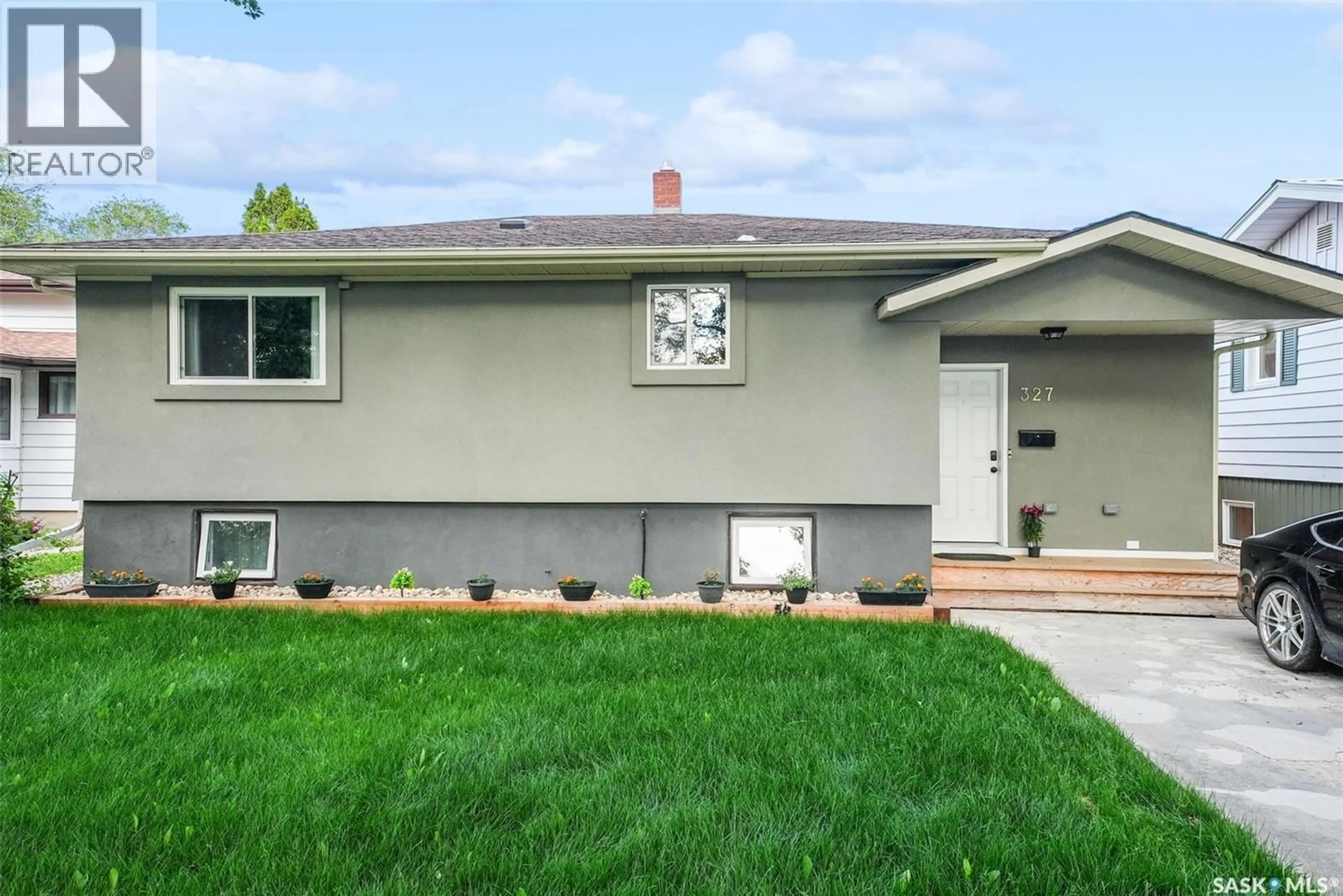 Home with vinyl exterior material, street for 327 RETALLACK STREET, Regina Saskatchewan S4R3N1