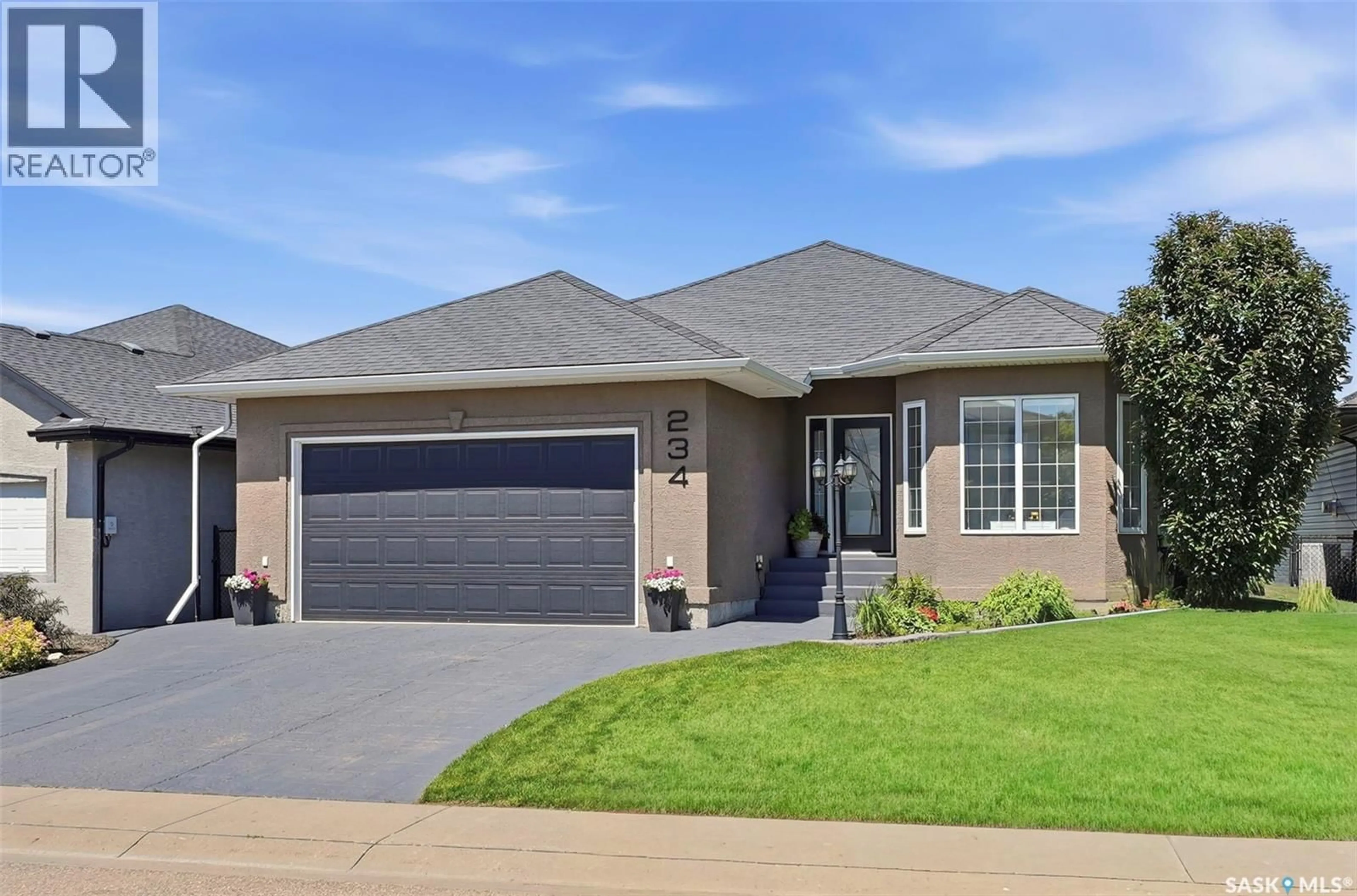 Home with brick exterior material, street for 234 DENHAM CRESCENT, Saskatoon Saskatchewan S7R1E9