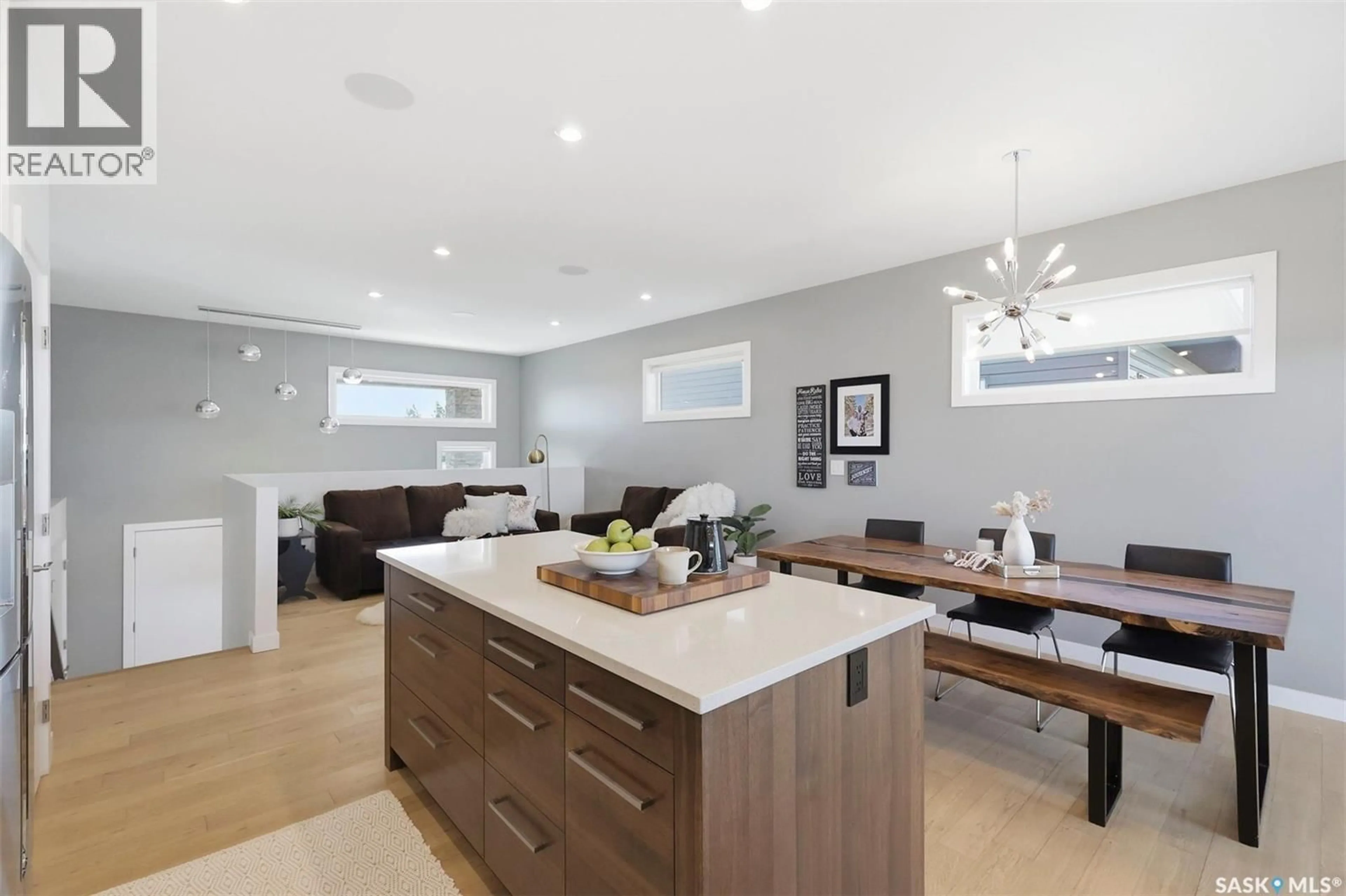 Open concept kitchen, wood/laminate floor for 905 SALMON WAY, Martensville Saskatchewan S0K2T1