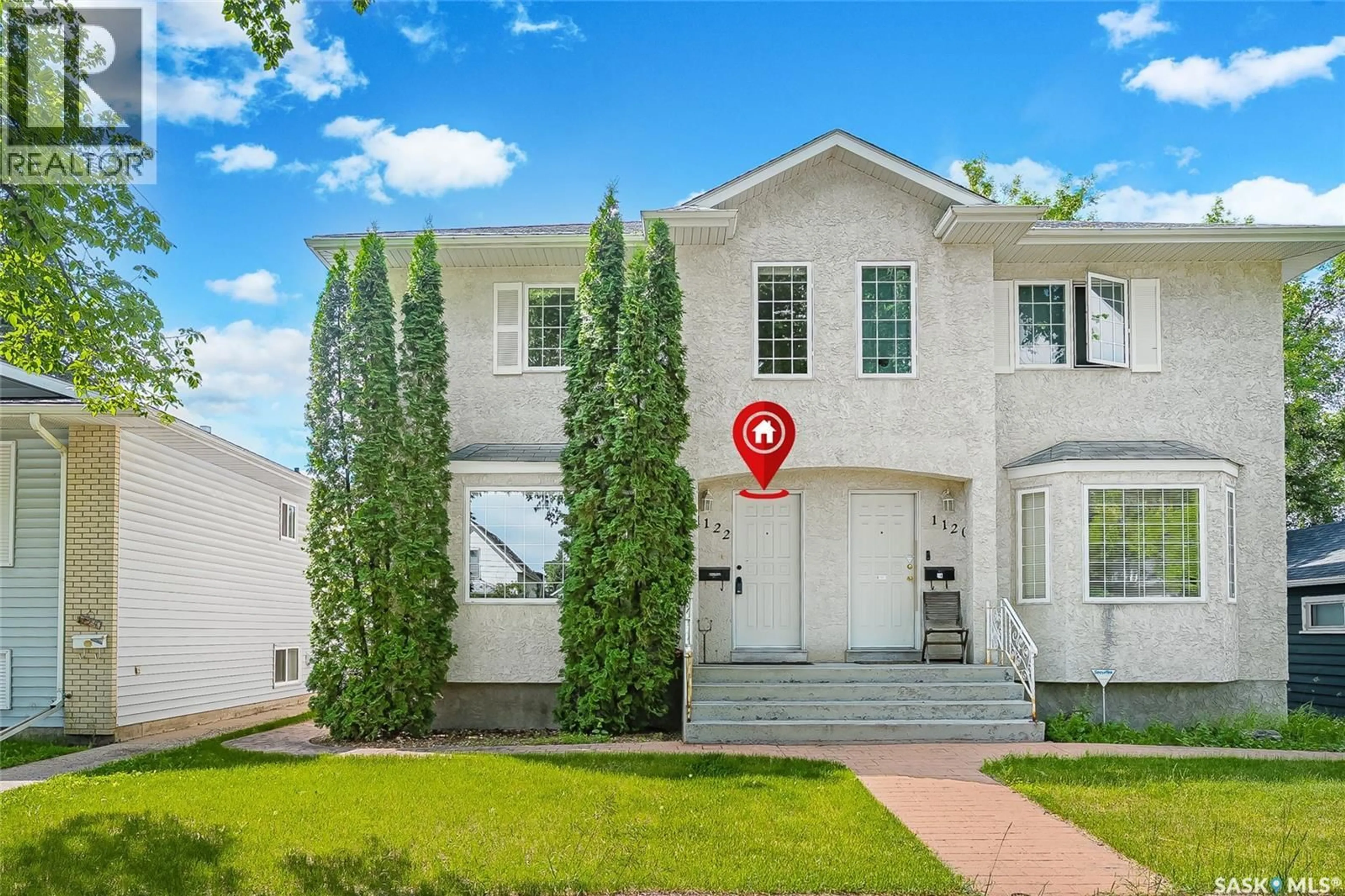 Home with vinyl exterior material, street for 1122 12TH STREET, Saskatoon Saskatchewan S7H0E2