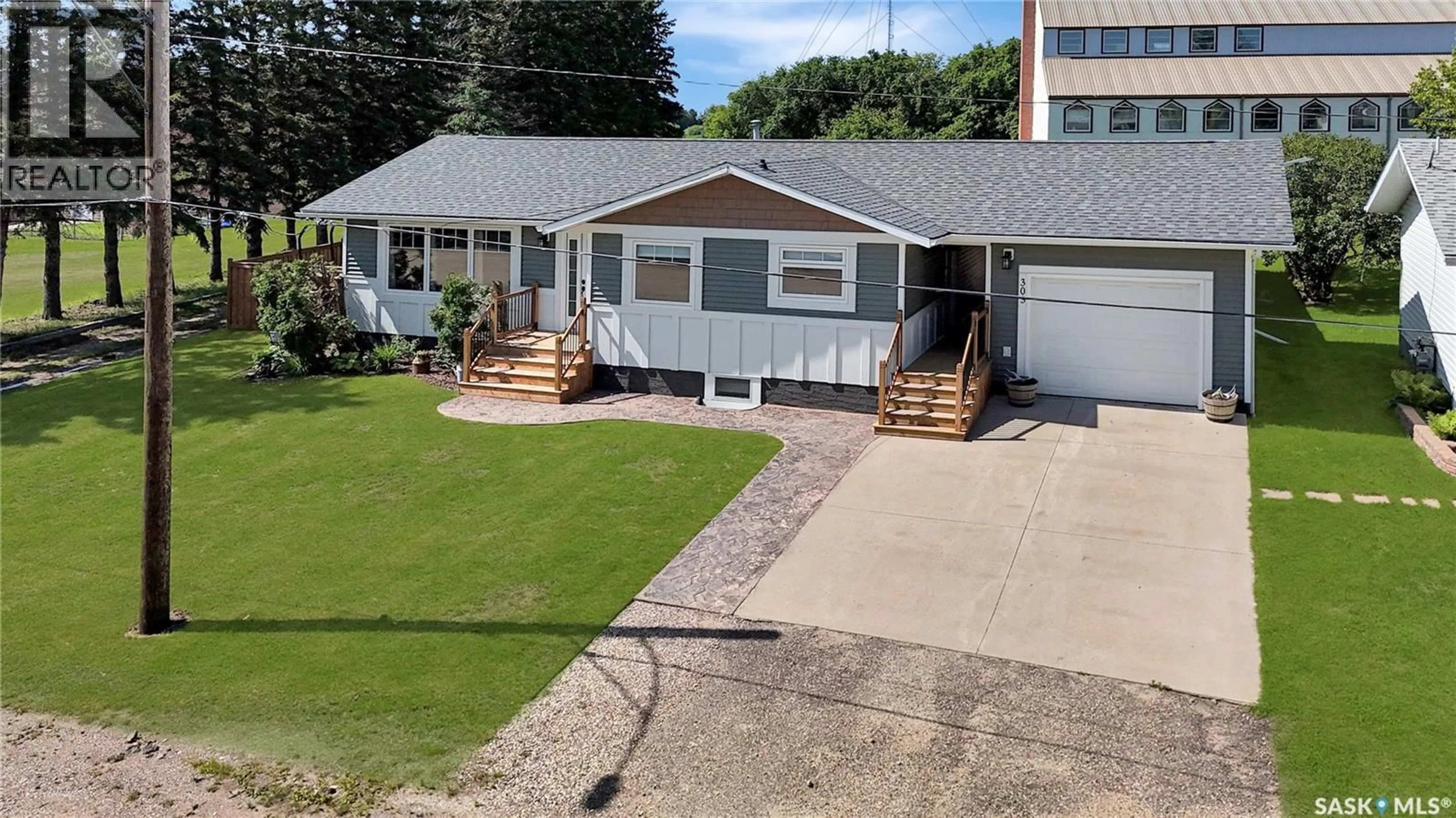 Home with vinyl exterior material, street for E - 303 3RD AVENUE, Debden Saskatchewan S0J0S0