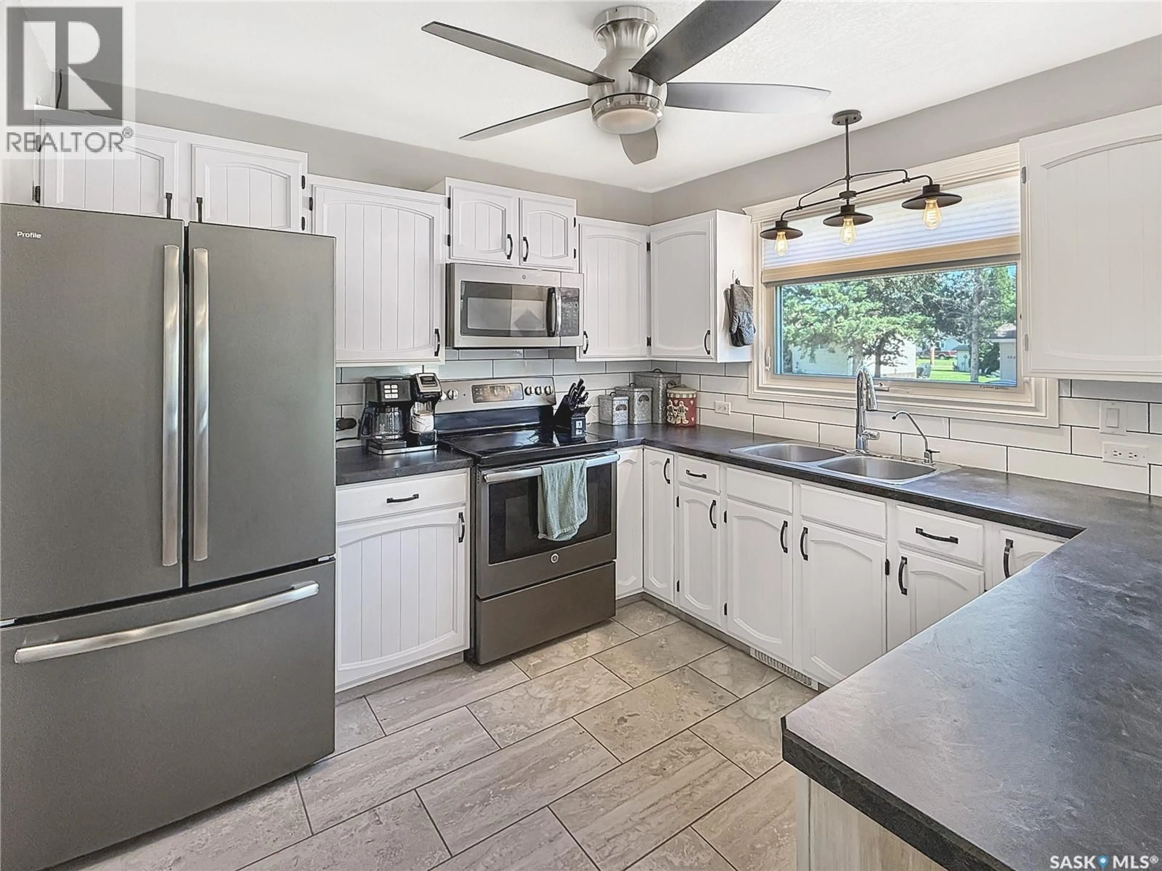 Open concept kitchen, ceramic/tile floor for E - 303 3RD AVENUE, Debden Saskatchewan S0J0S0