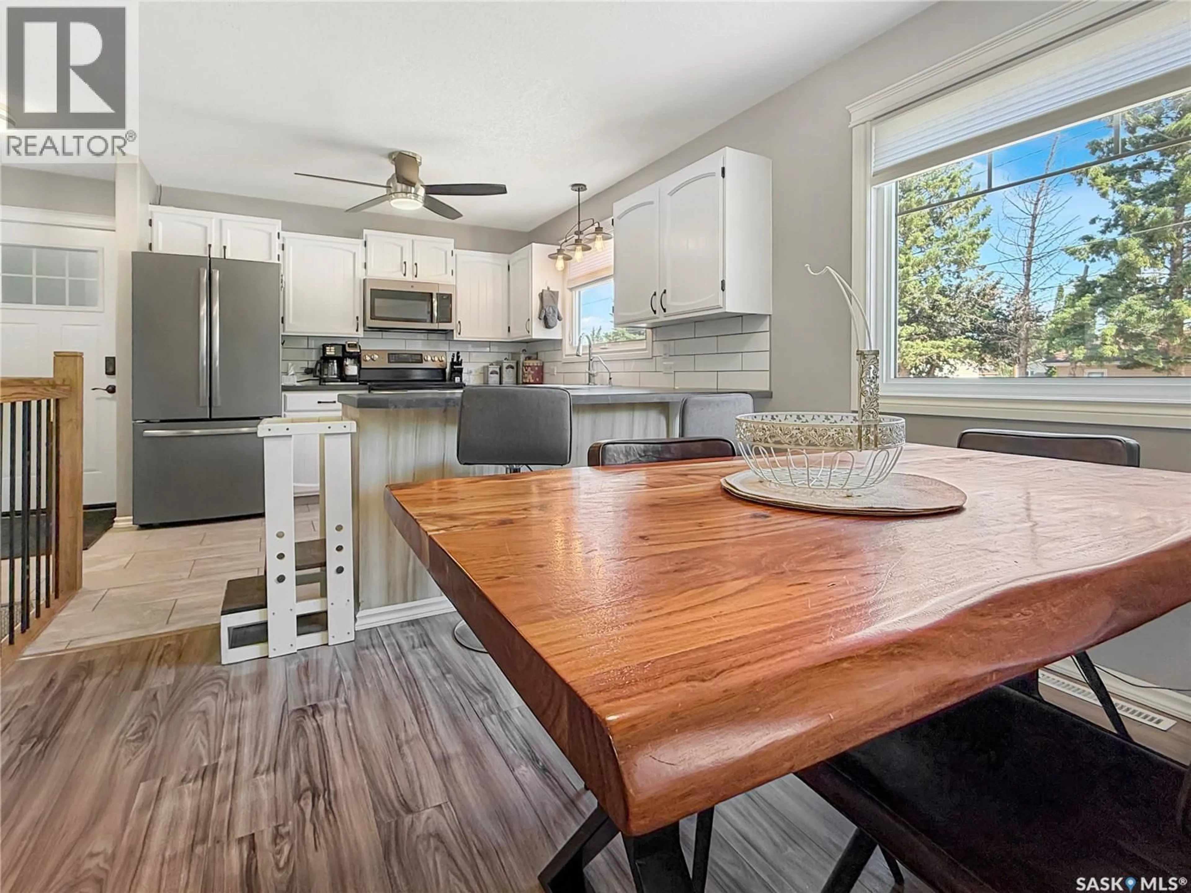Open concept kitchen, wood/laminate floor for E - 303 3RD AVENUE, Debden Saskatchewan S0J0S0