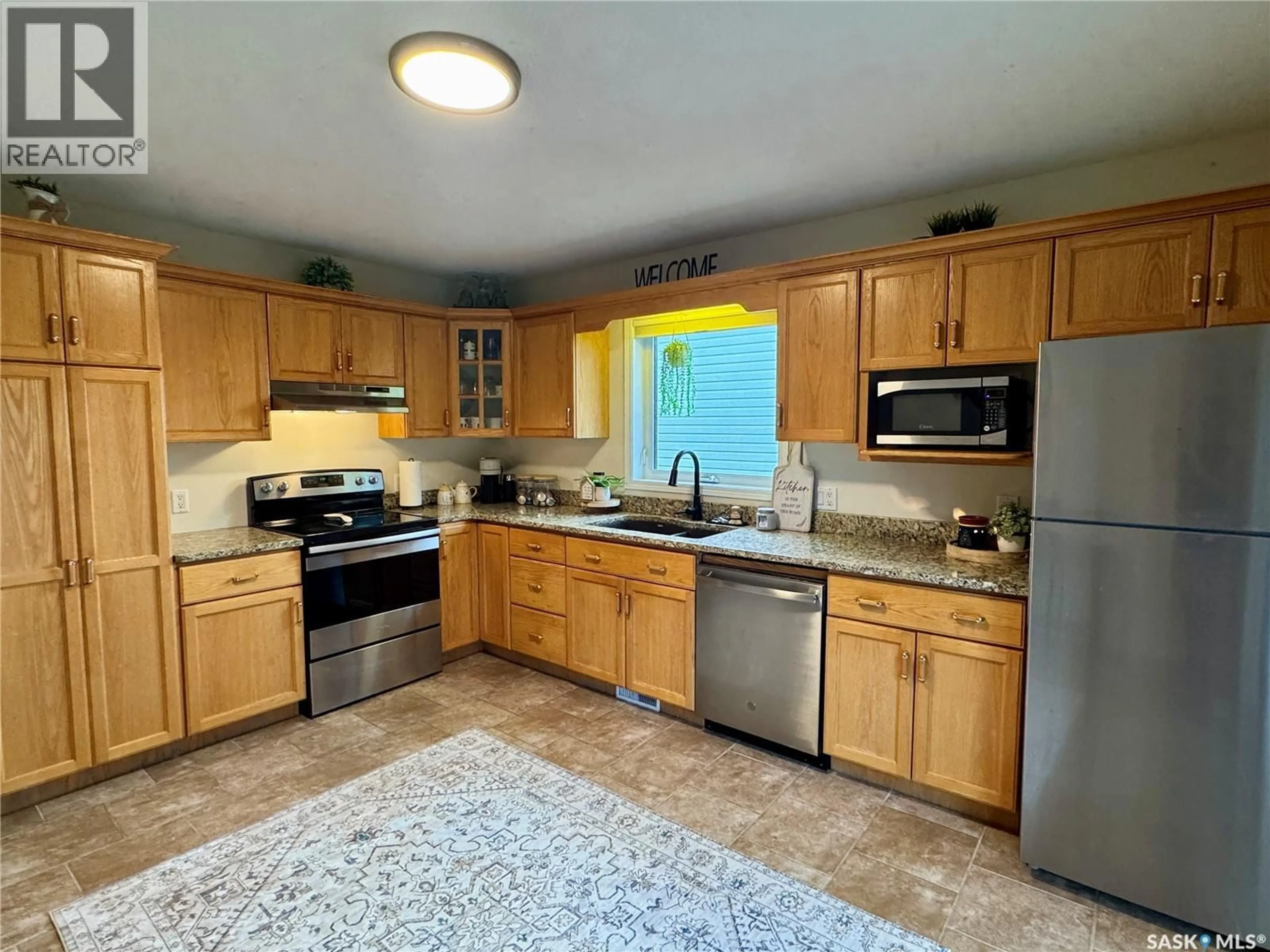 Standard kitchen, ceramic/tile floor for 109 WATT PLACE, La Ronge Saskatchewan S0J1L0