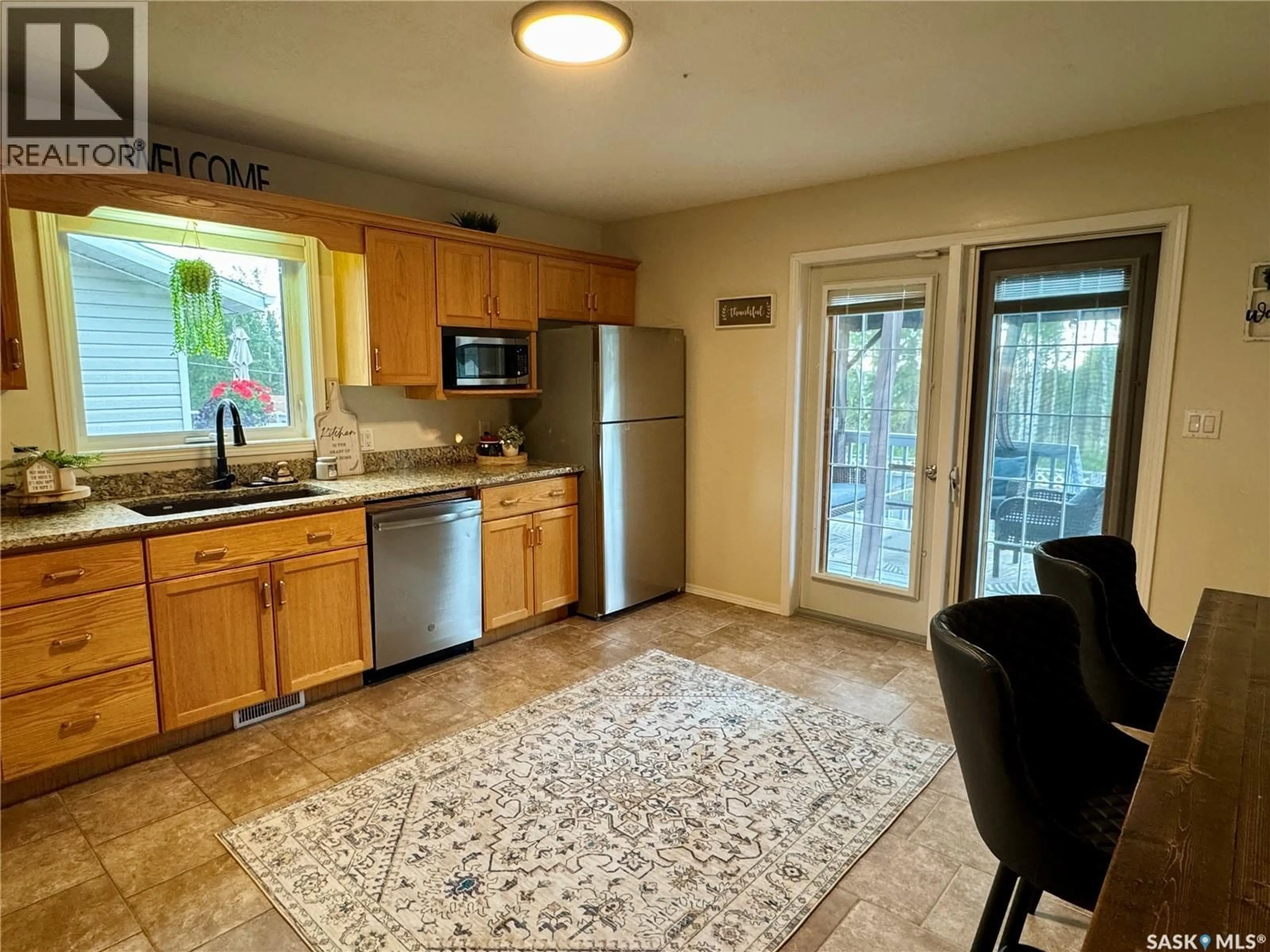 Standard kitchen, ceramic/tile floor for 109 WATT PLACE, La Ronge Saskatchewan S0J1L0