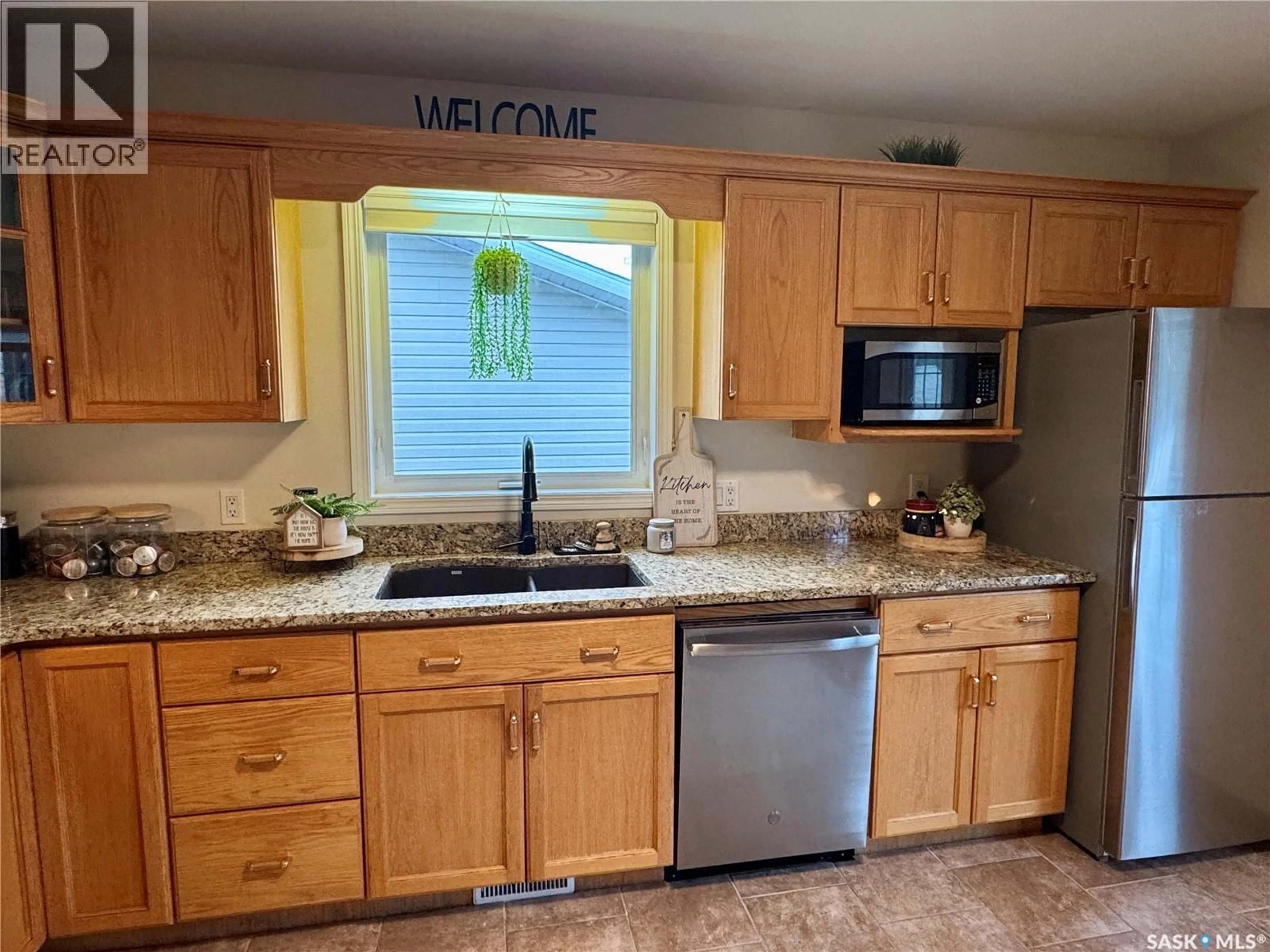 Standard kitchen, ceramic/tile floor for 109 WATT PLACE, La Ronge Saskatchewan S0J1L0