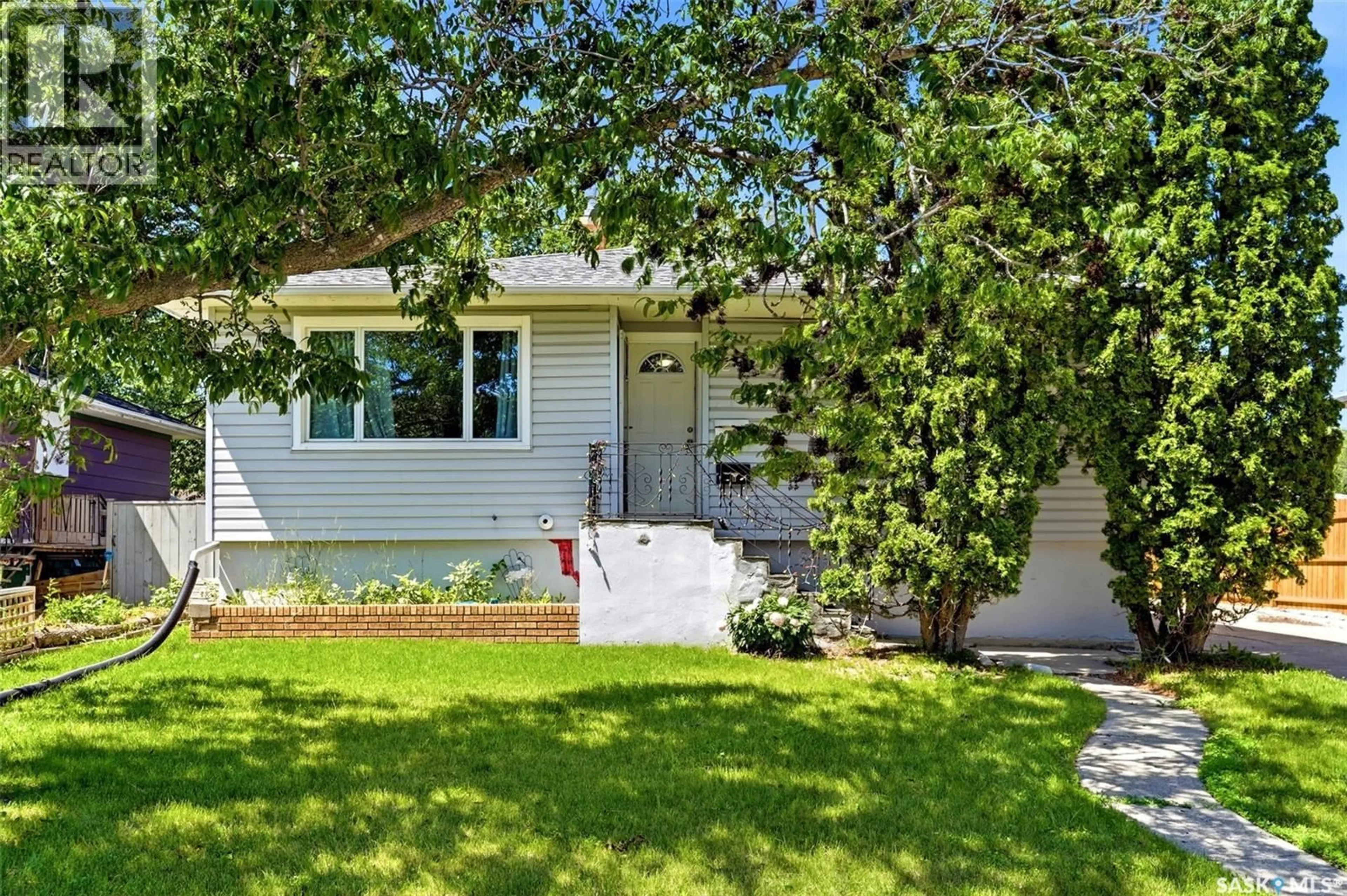 Home with vinyl exterior material, street for 2426 HARVEY STREET, Regina Saskatchewan S4N2N4