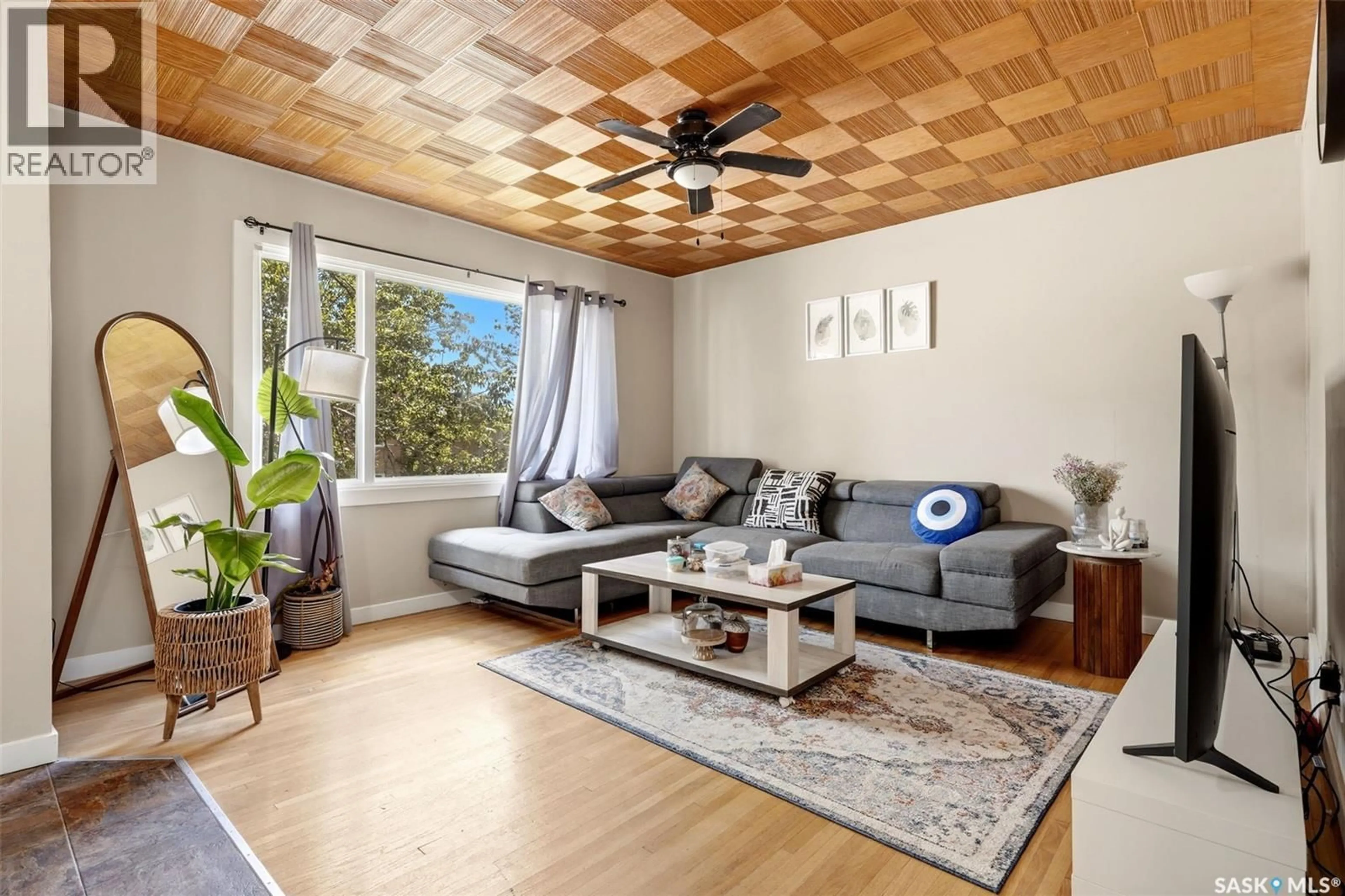 Living room with furniture, wood/laminate floor for 2426 HARVEY STREET, Regina Saskatchewan S4N2N4
