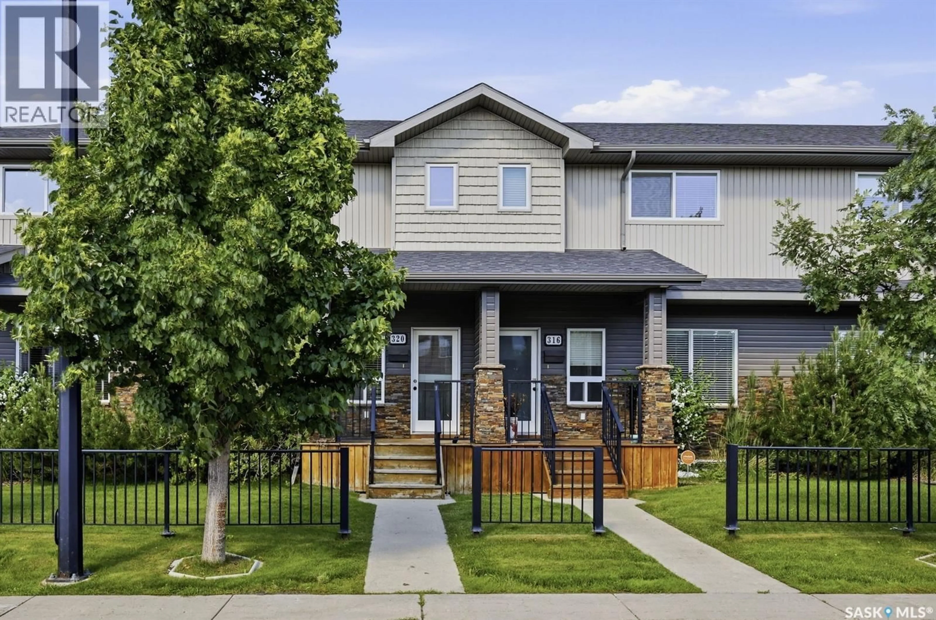 Home with vinyl exterior material, street for 320 WILLOWGROVE LANE, Saskatoon Saskatchewan S7W0H7