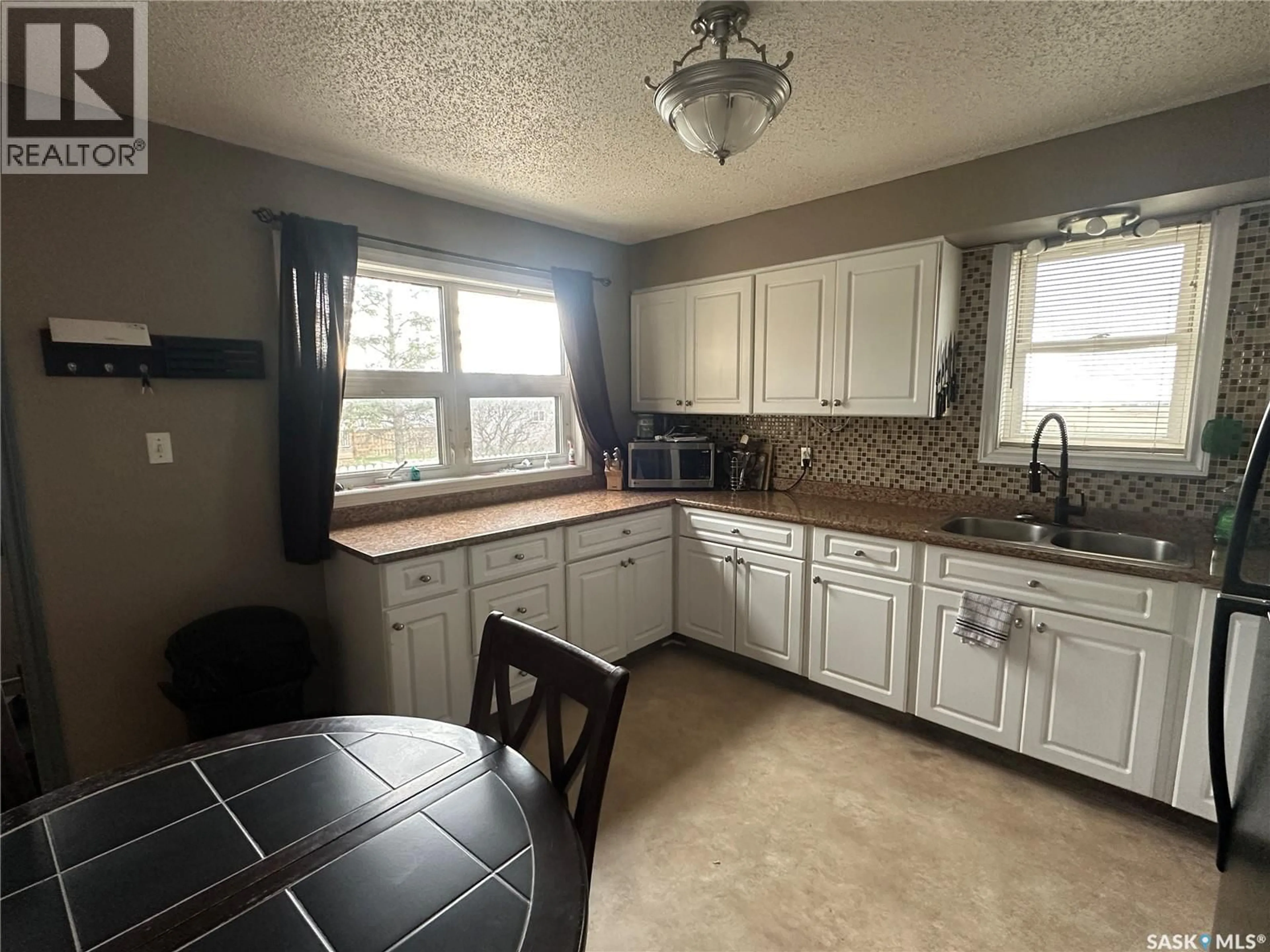 Standard kitchen, ceramic/tile floor for 102 9TH AVENUE, Weyburn Saskatchewan S4H1Z7