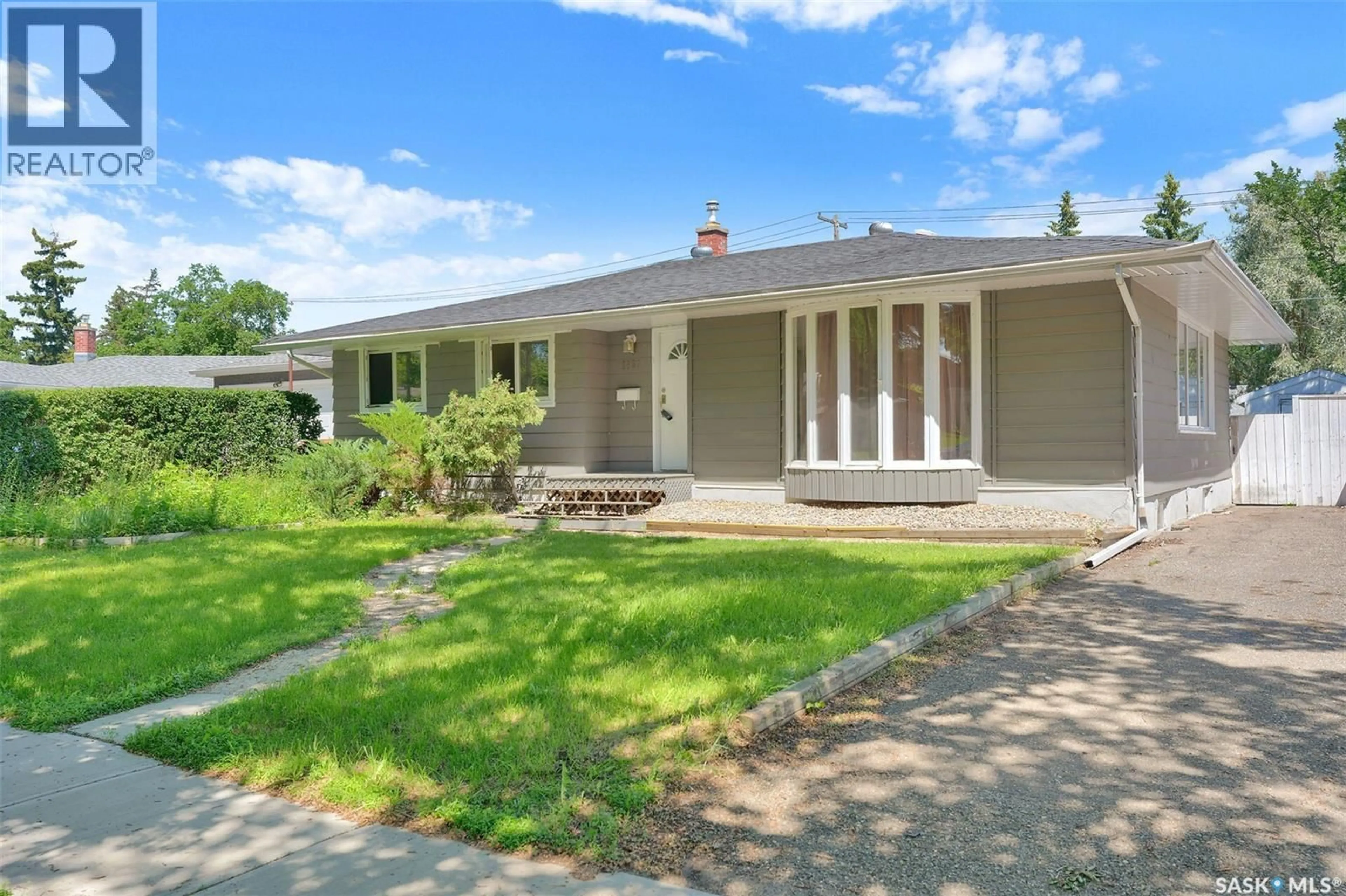 Home with vinyl exterior material, street for 1830 COWAN CRESCENT, Regina Saskatchewan S4S4C6