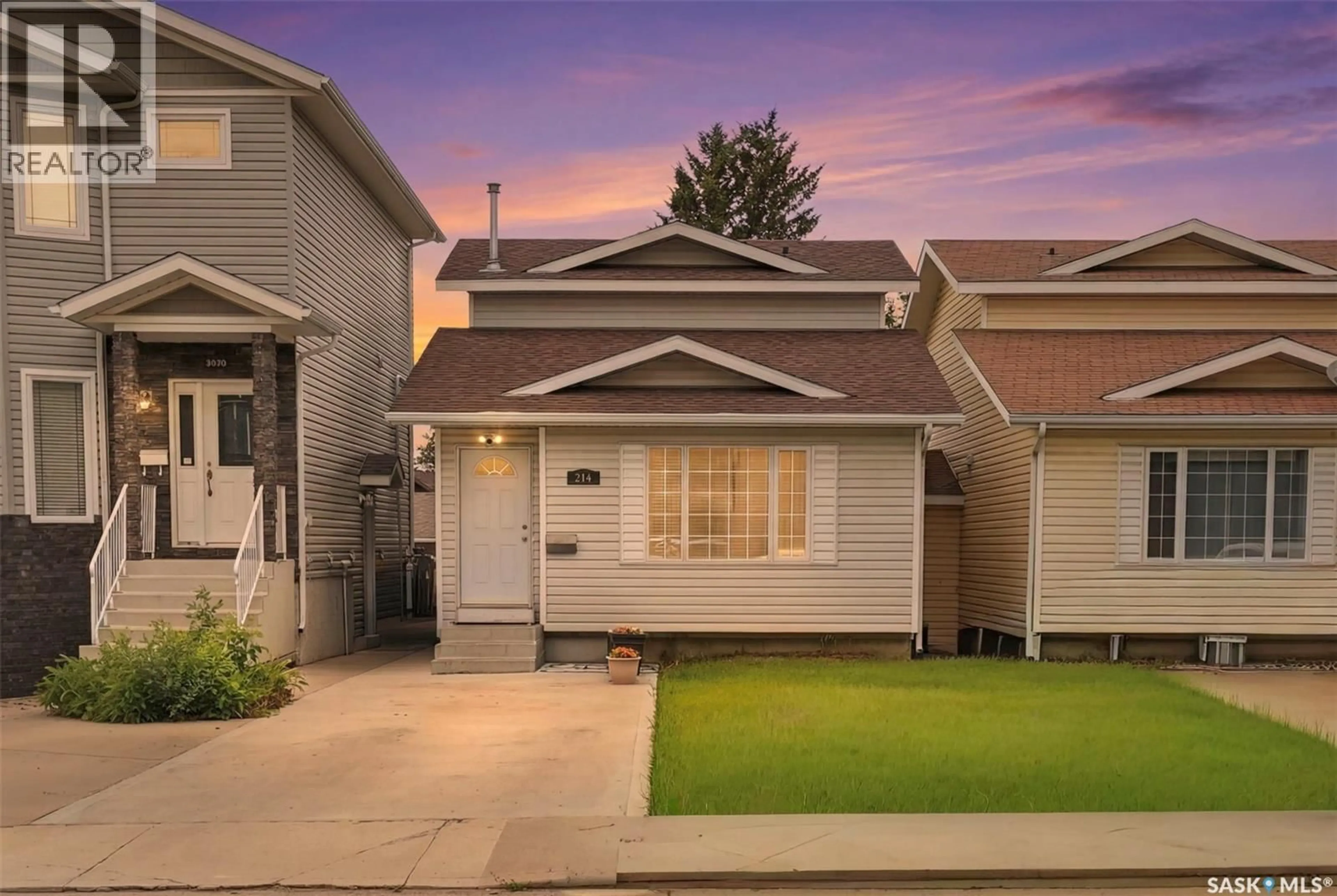 Home with vinyl exterior material, street for 214 DUNLOP STREET, Saskatoon Saskatchewan S7N2B7