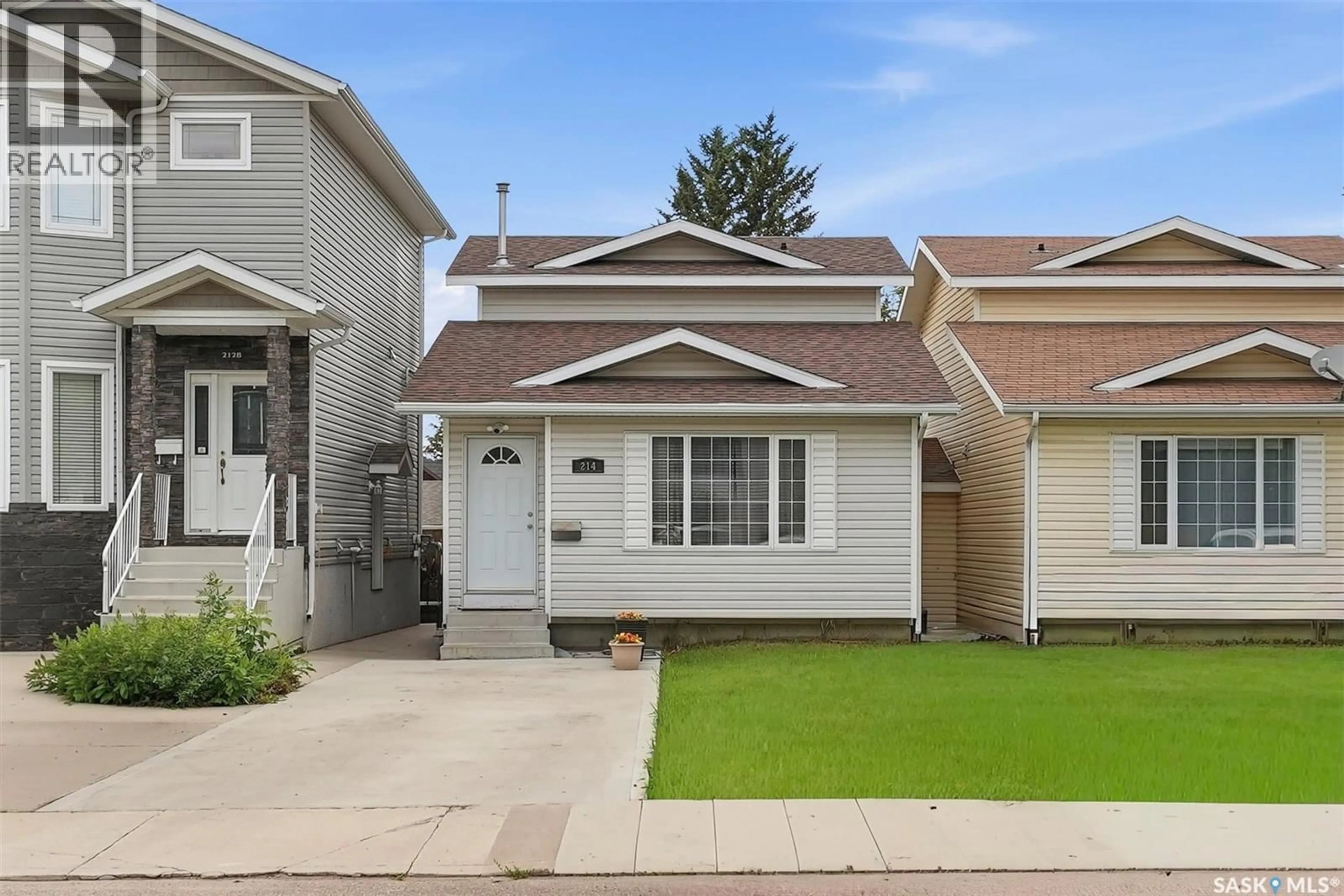 Home with vinyl exterior material, street for 214 DUNLOP STREET, Saskatoon Saskatchewan S7N2B7